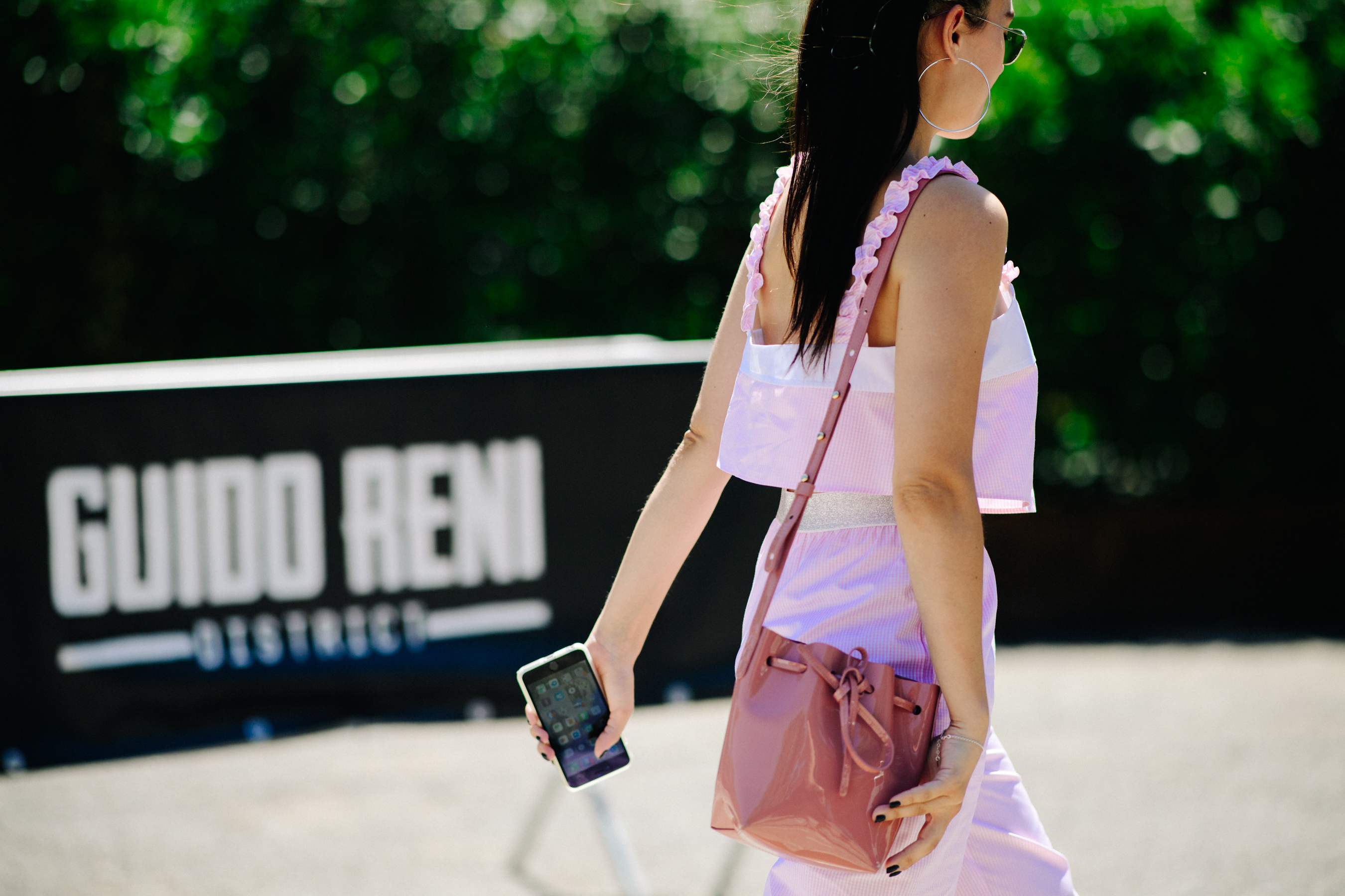 A girl carrying her iPhone
