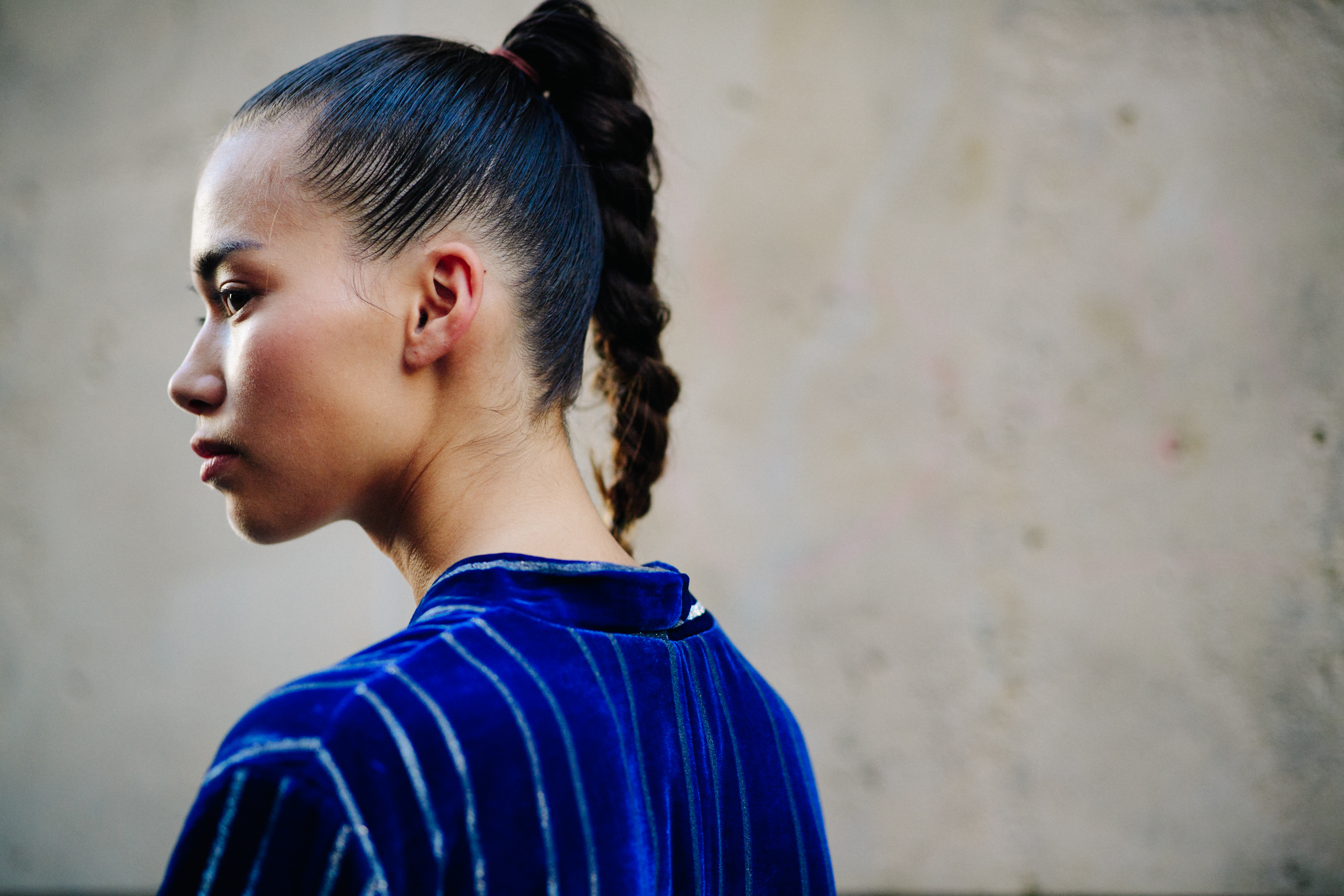 Model wearing a blue striped shirt