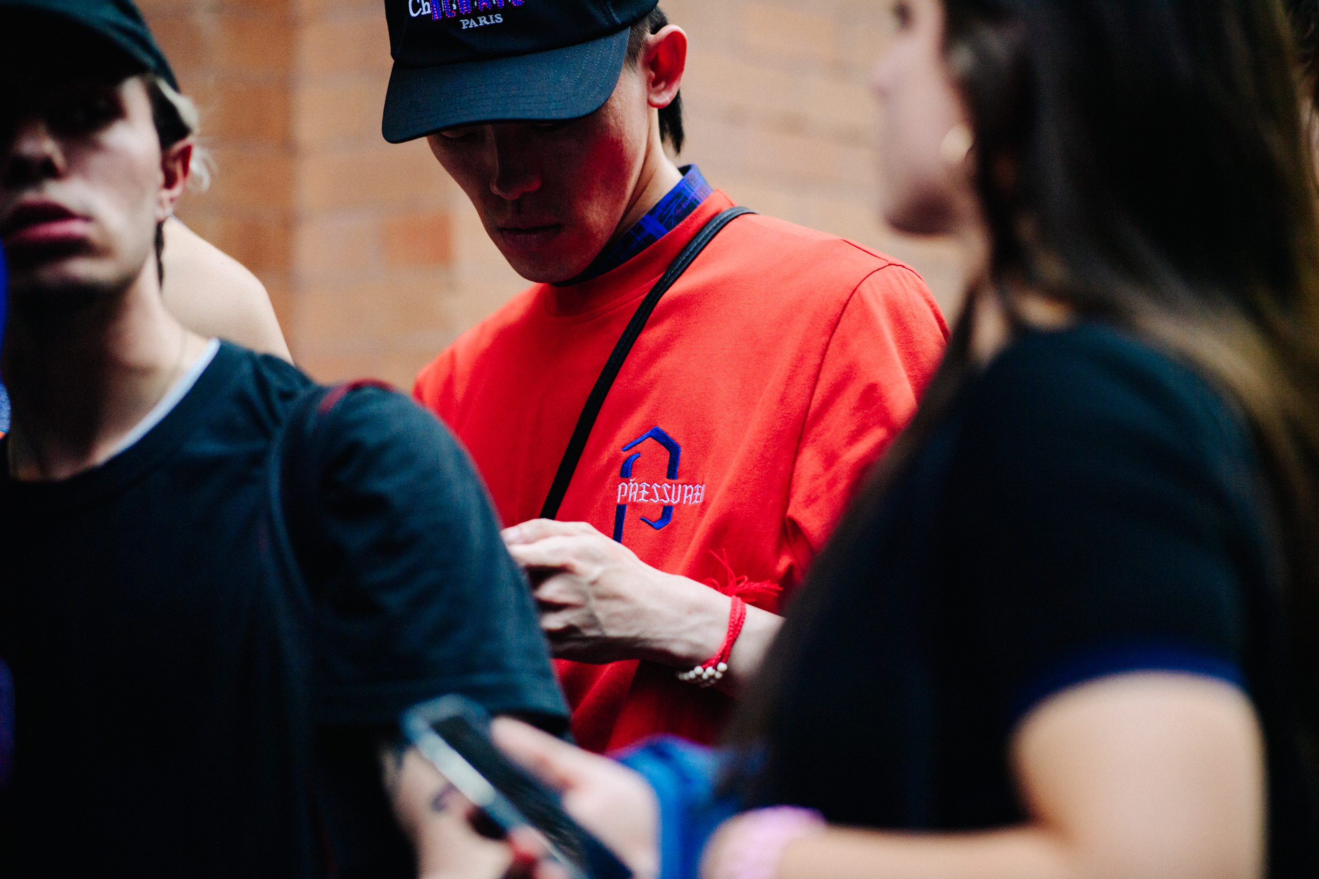 Man wearing red t-shirt and hat