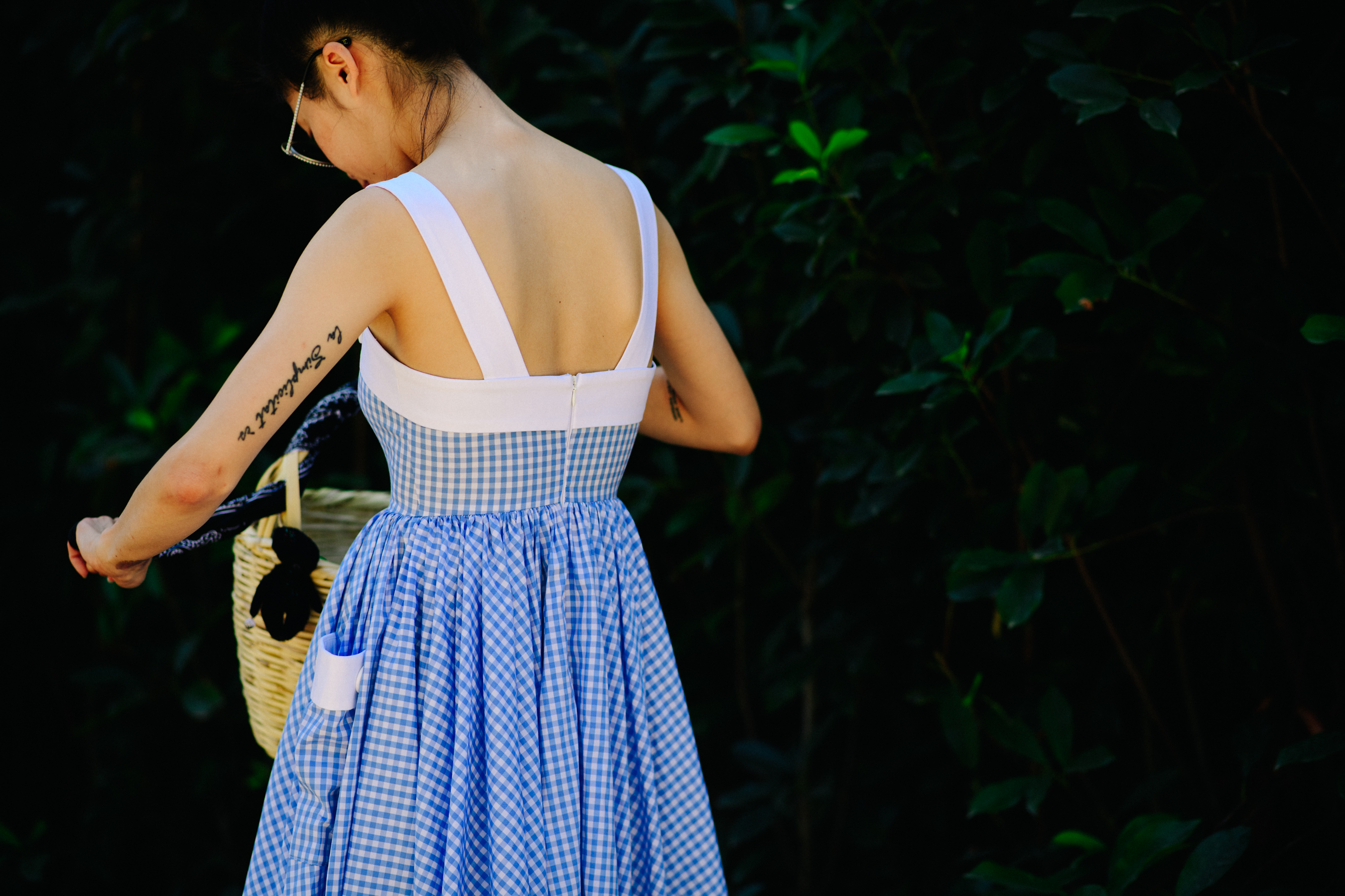 Woman wearing a blue checkered dress