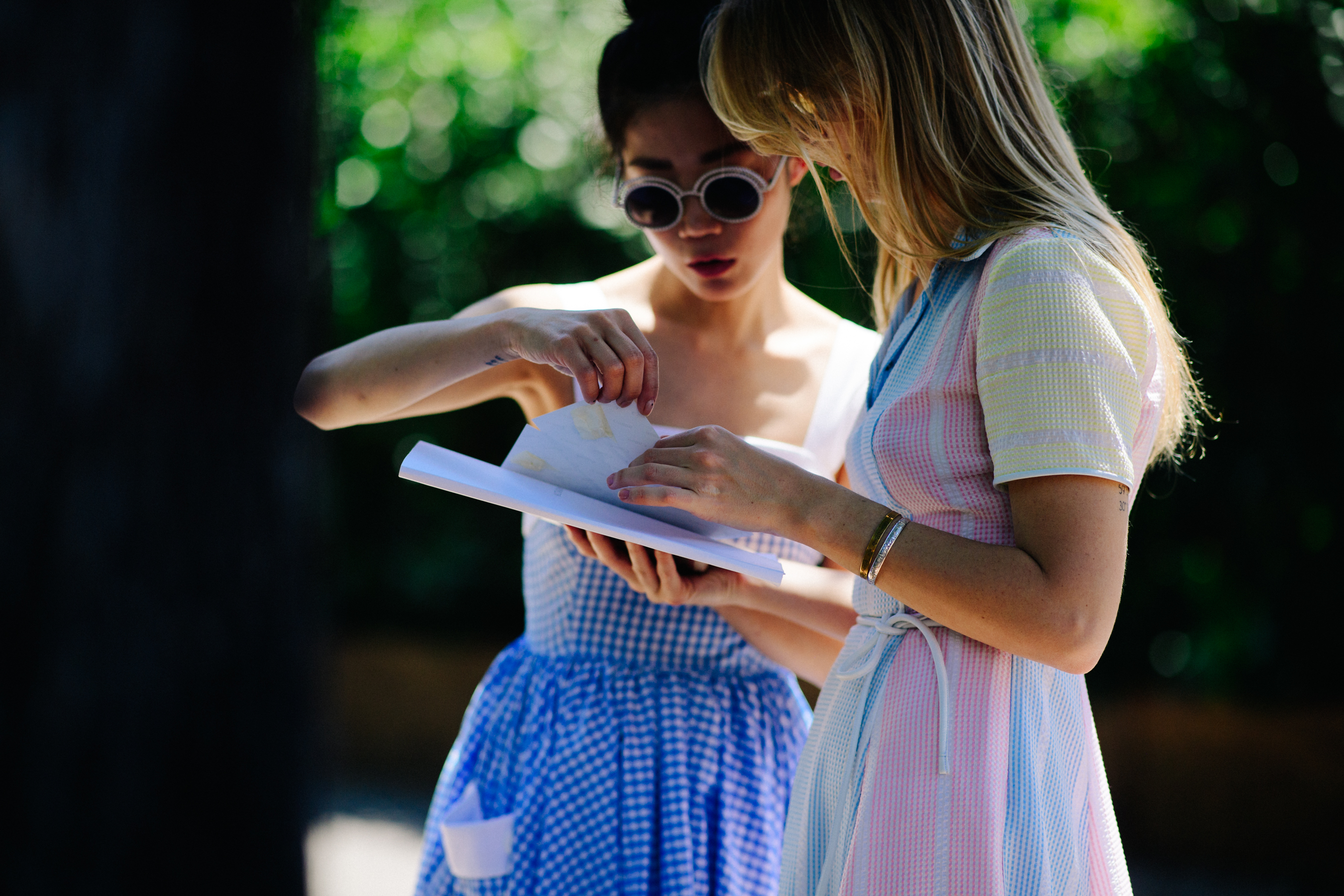 Two girls interacting on the street