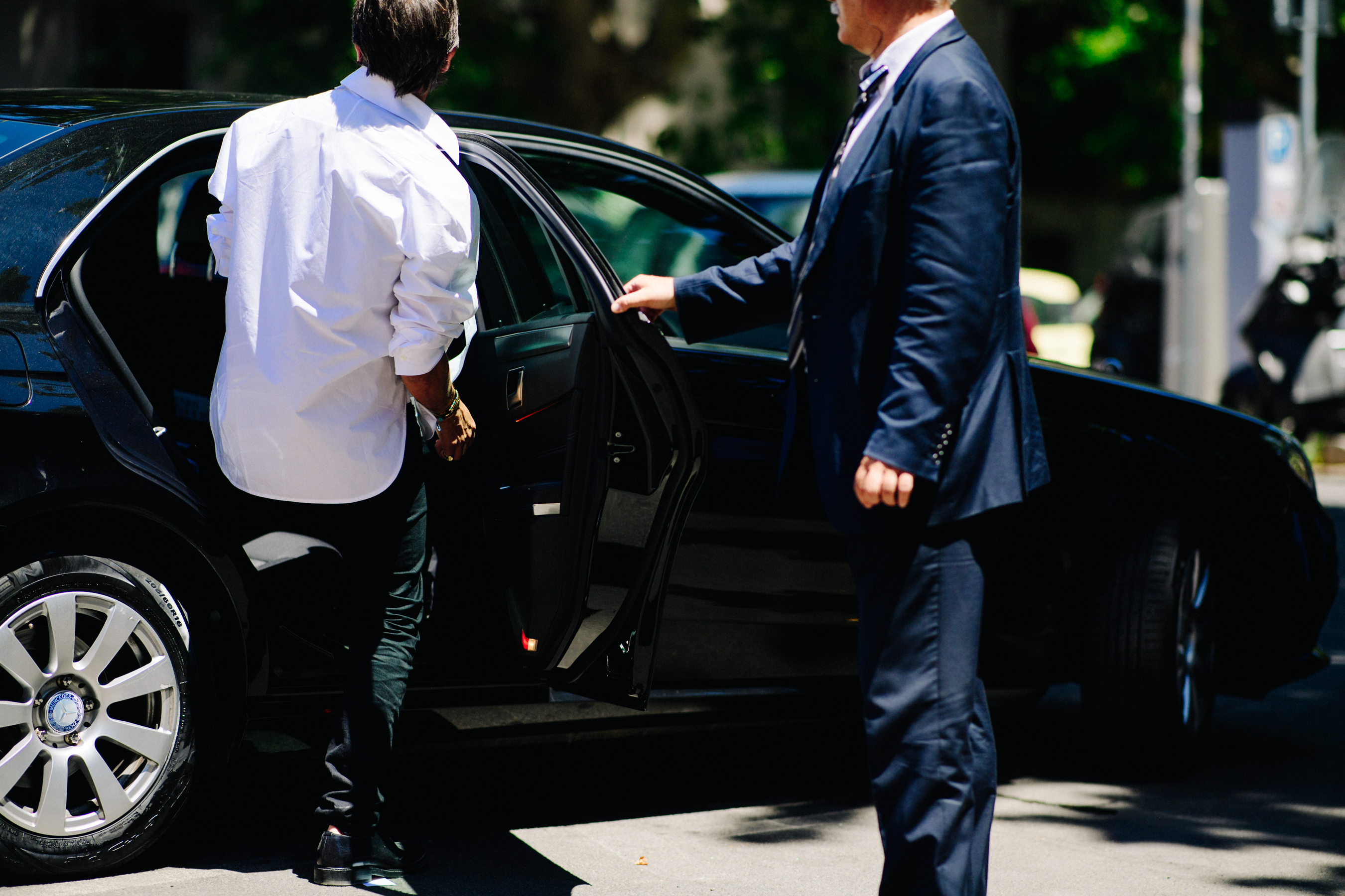 Man entering a Mercedes-Benz