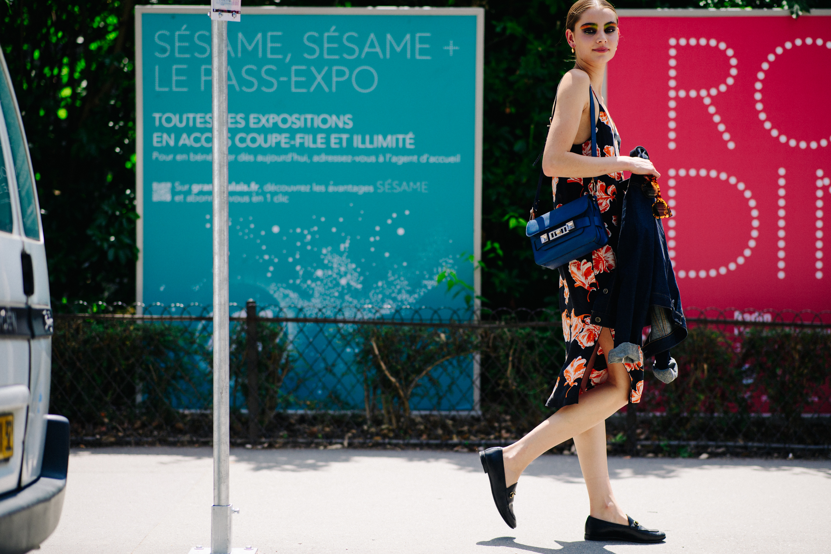 Model wearing floral dress after Chanel