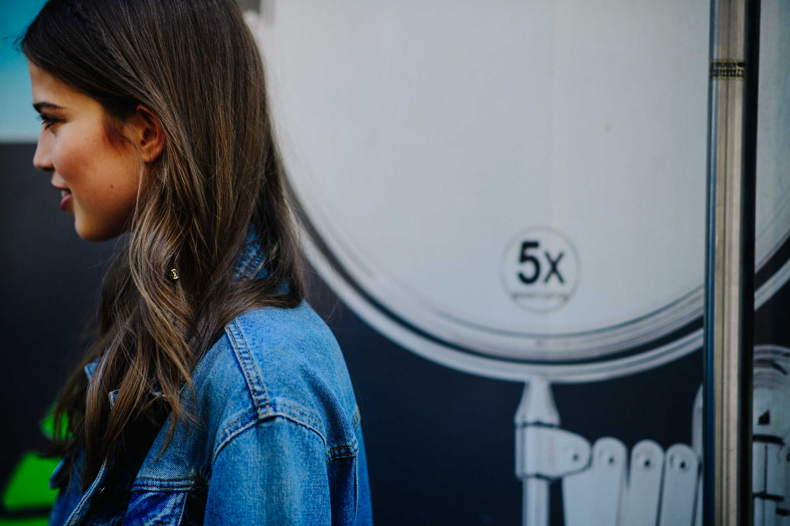 Female model wearing a denim jacket