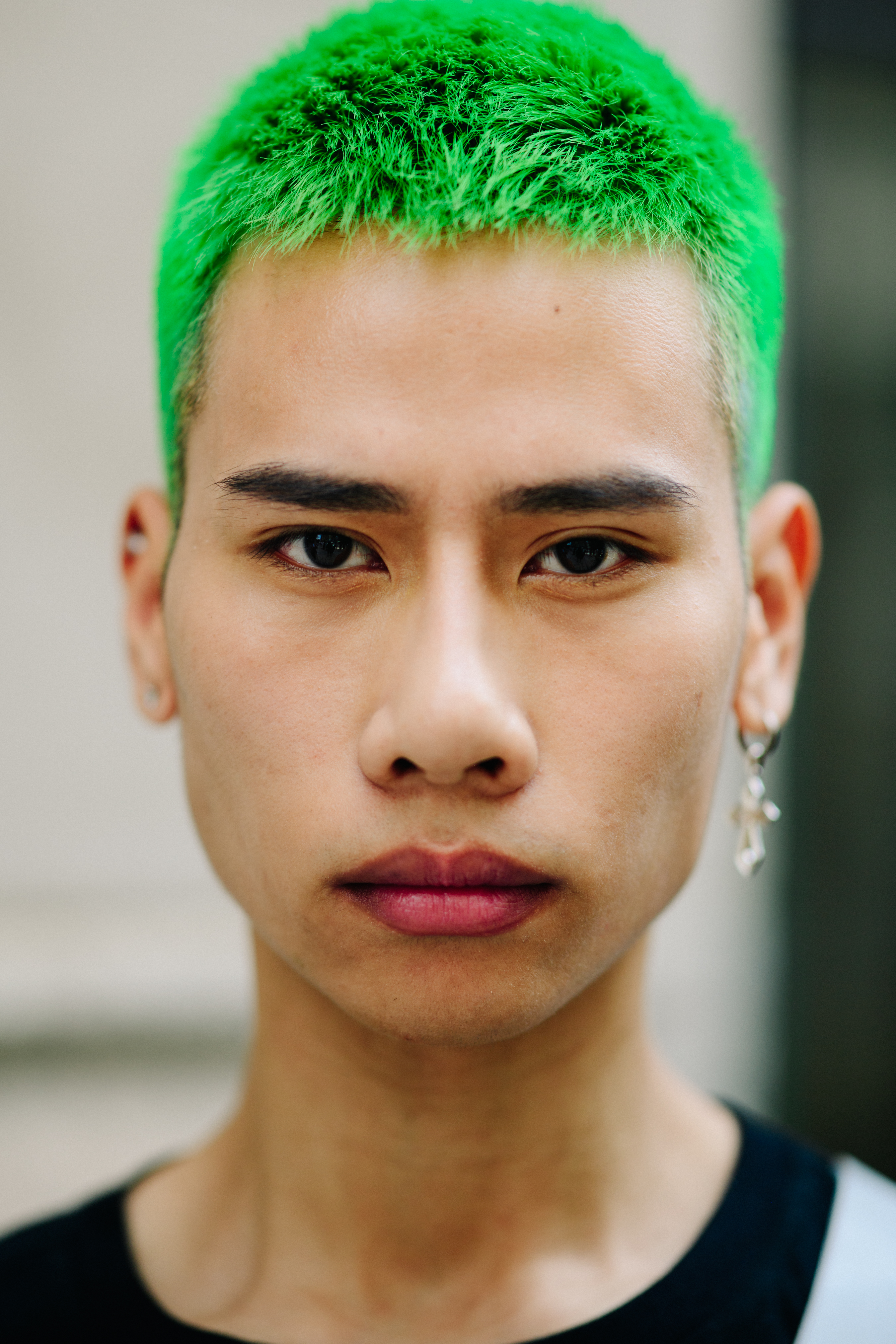 Portrait of a male model with green hair