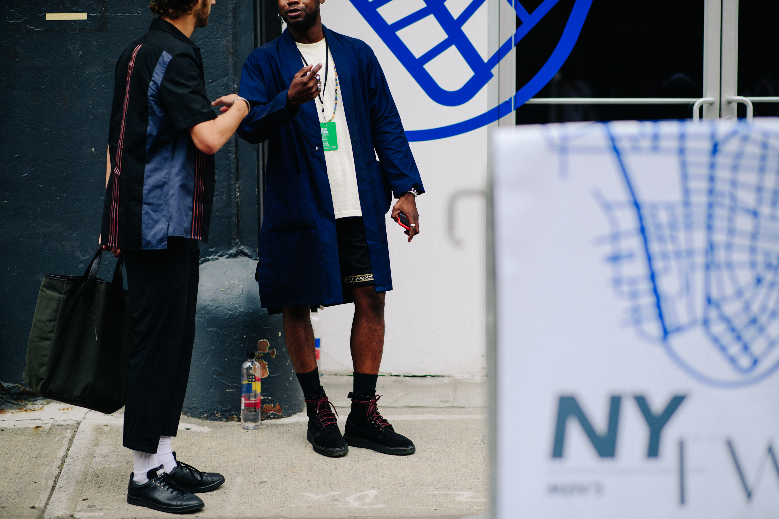 Two men wearing blue clothes