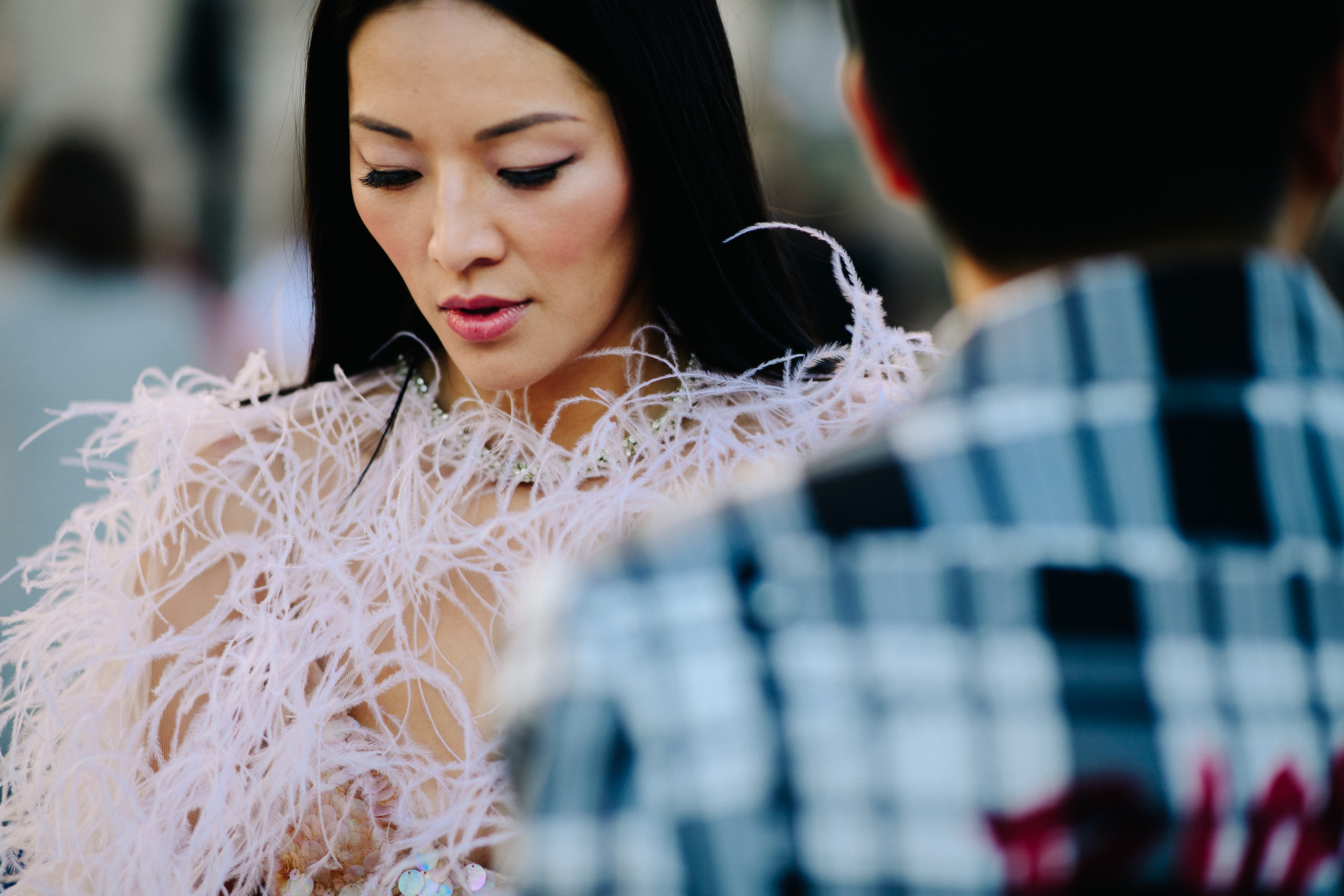 Blogger wearing ferather dress