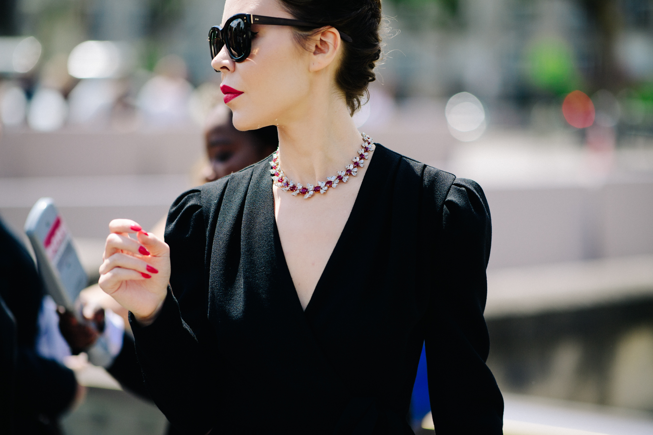 Russian couture designer wearing black blazer
