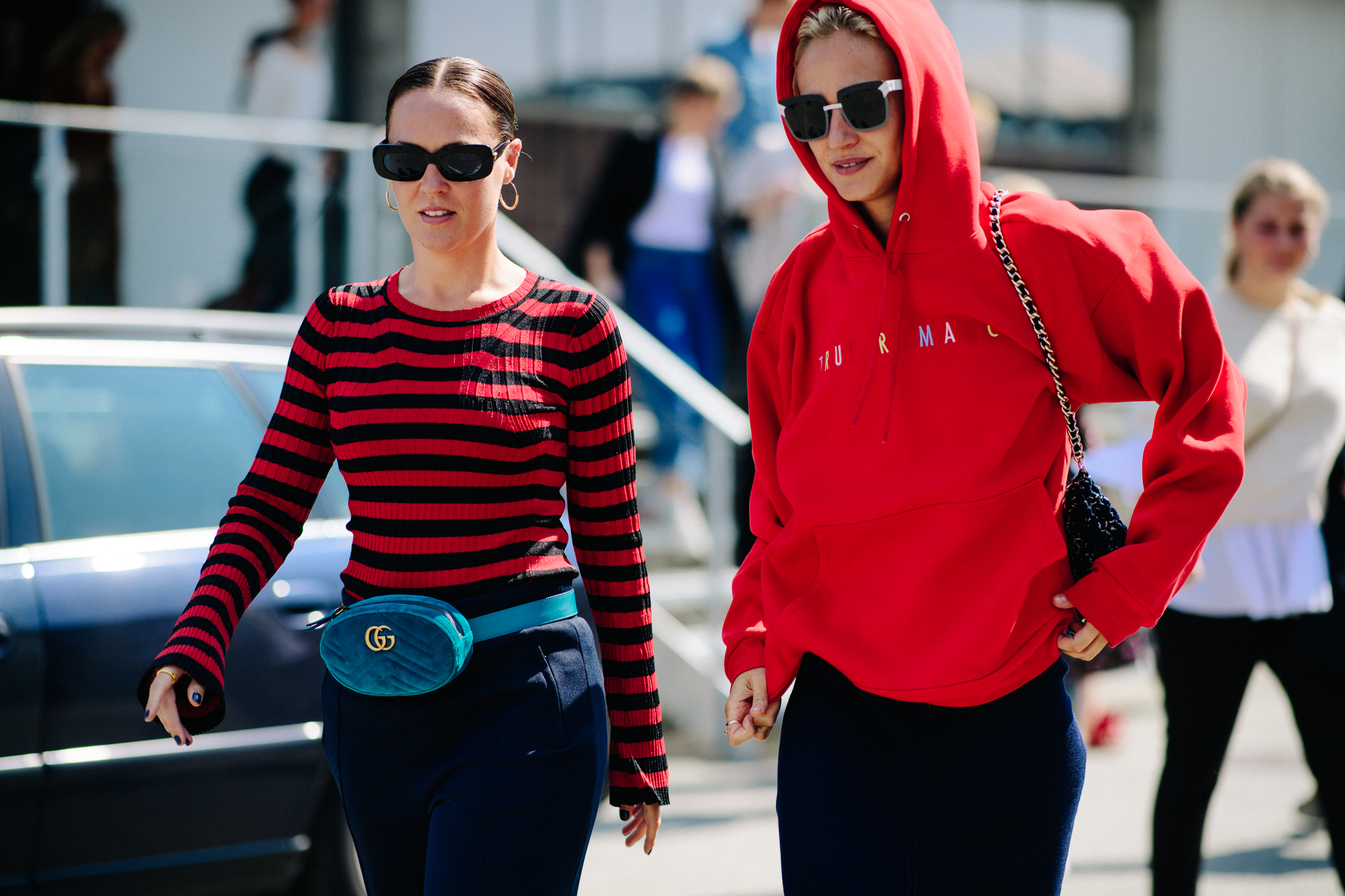 Two women wearing red clothes