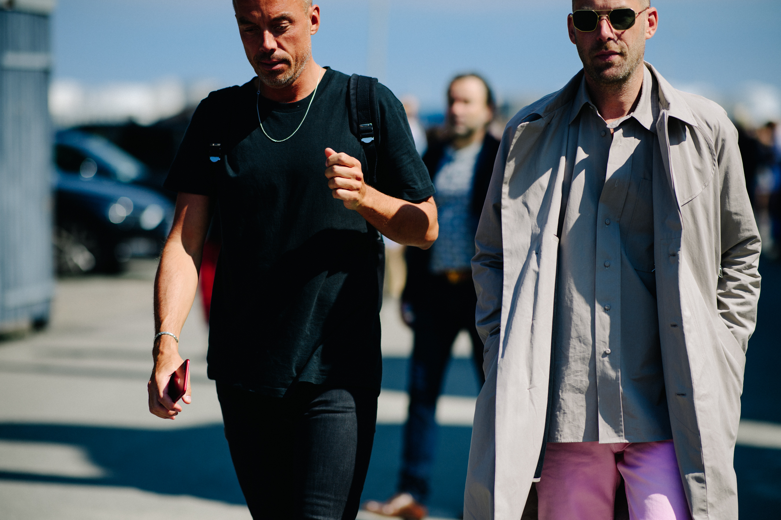 Two men wearing pink pants