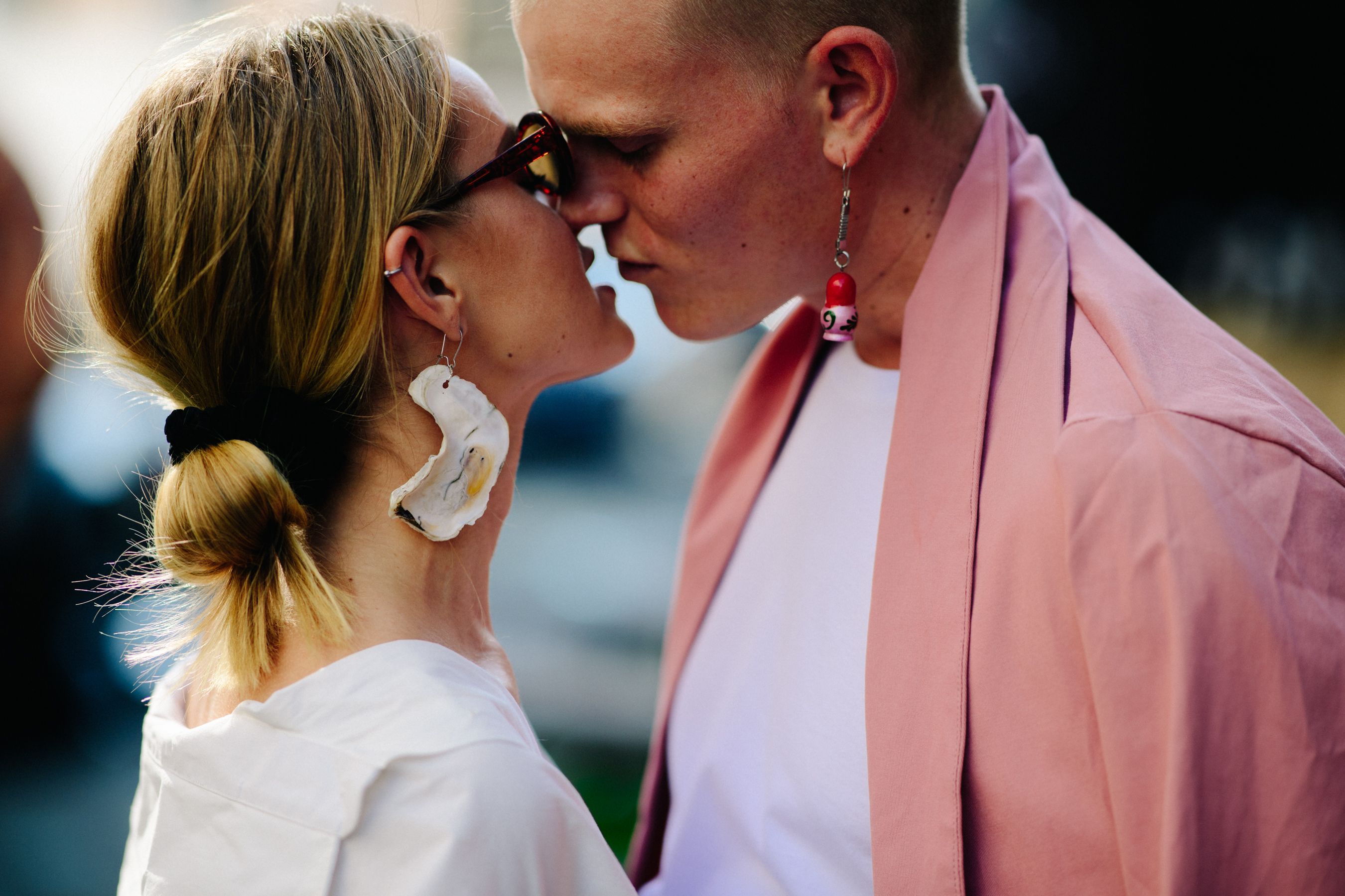 Man and woman wearing earrings