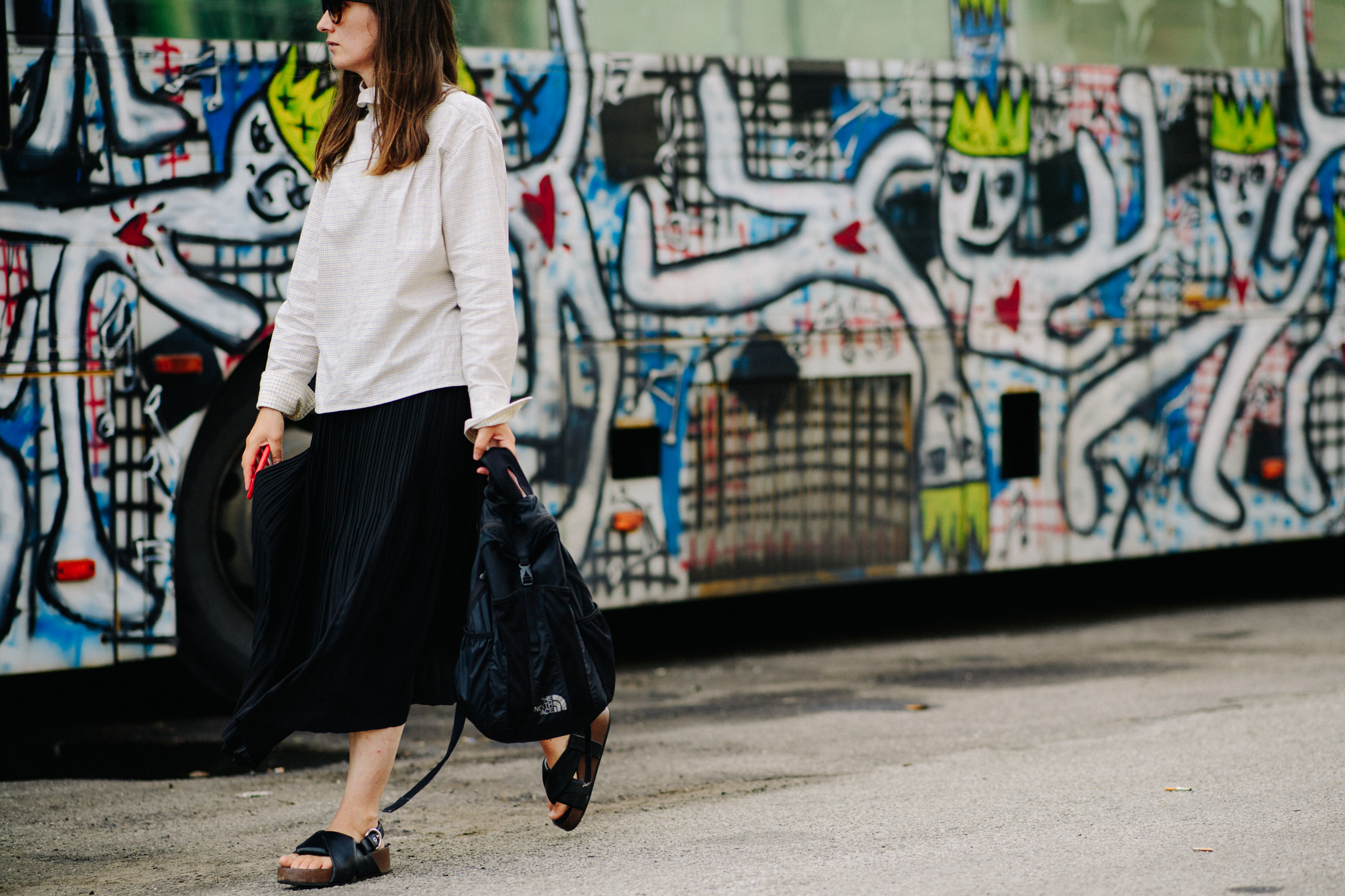 Woman wearing white shirt and flip flops