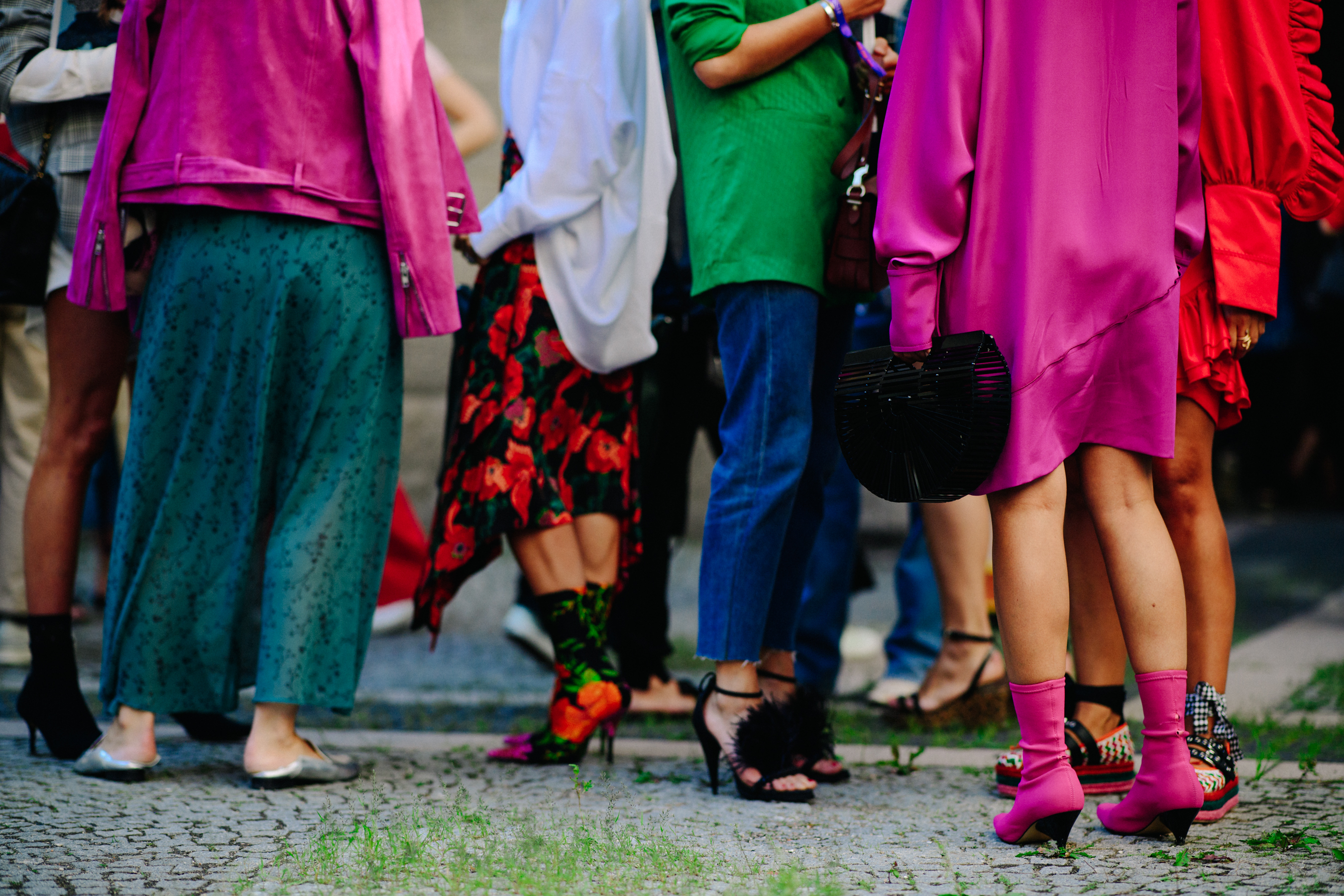 Group of bloggers wearing colourful outfits