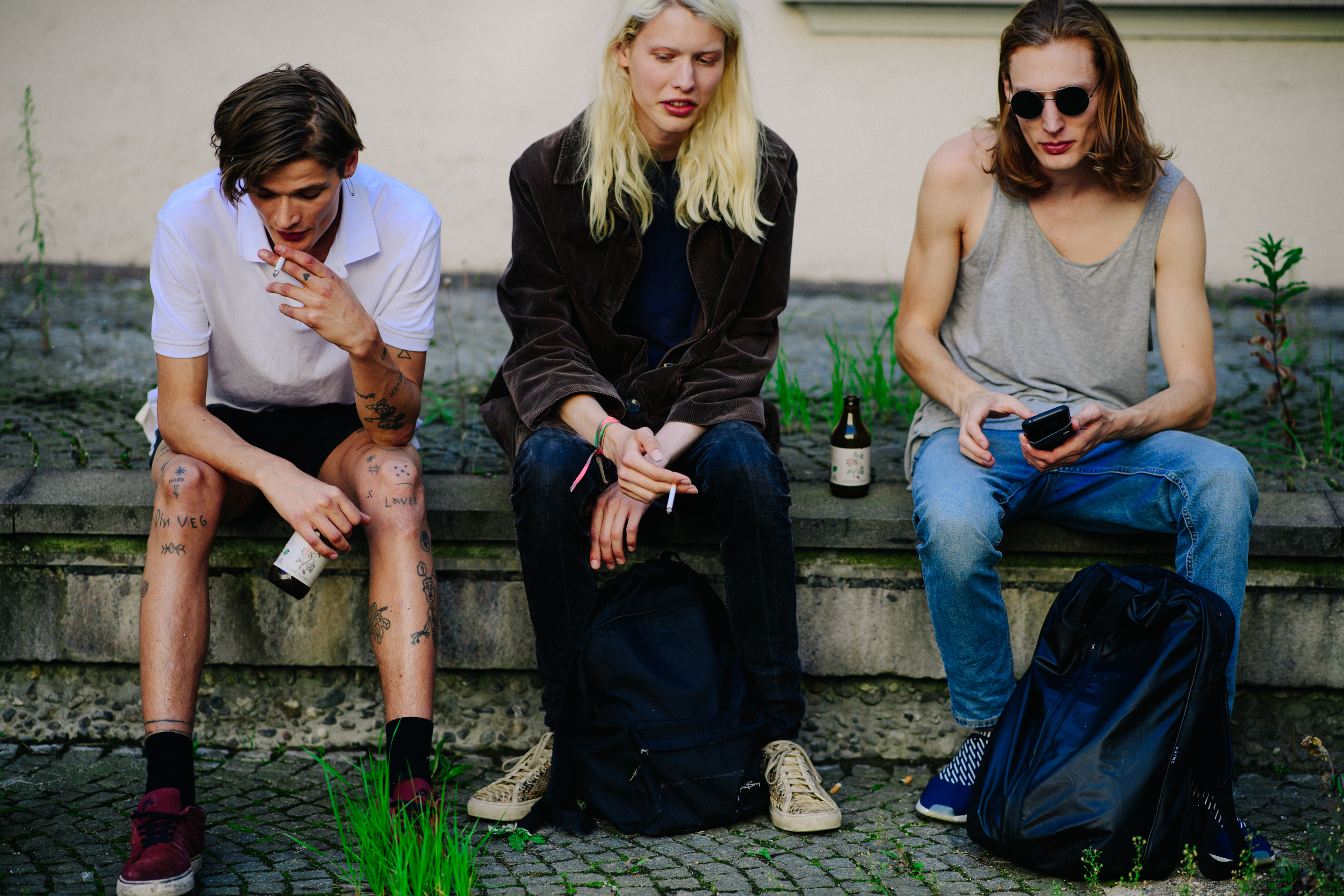 Three male models after a show