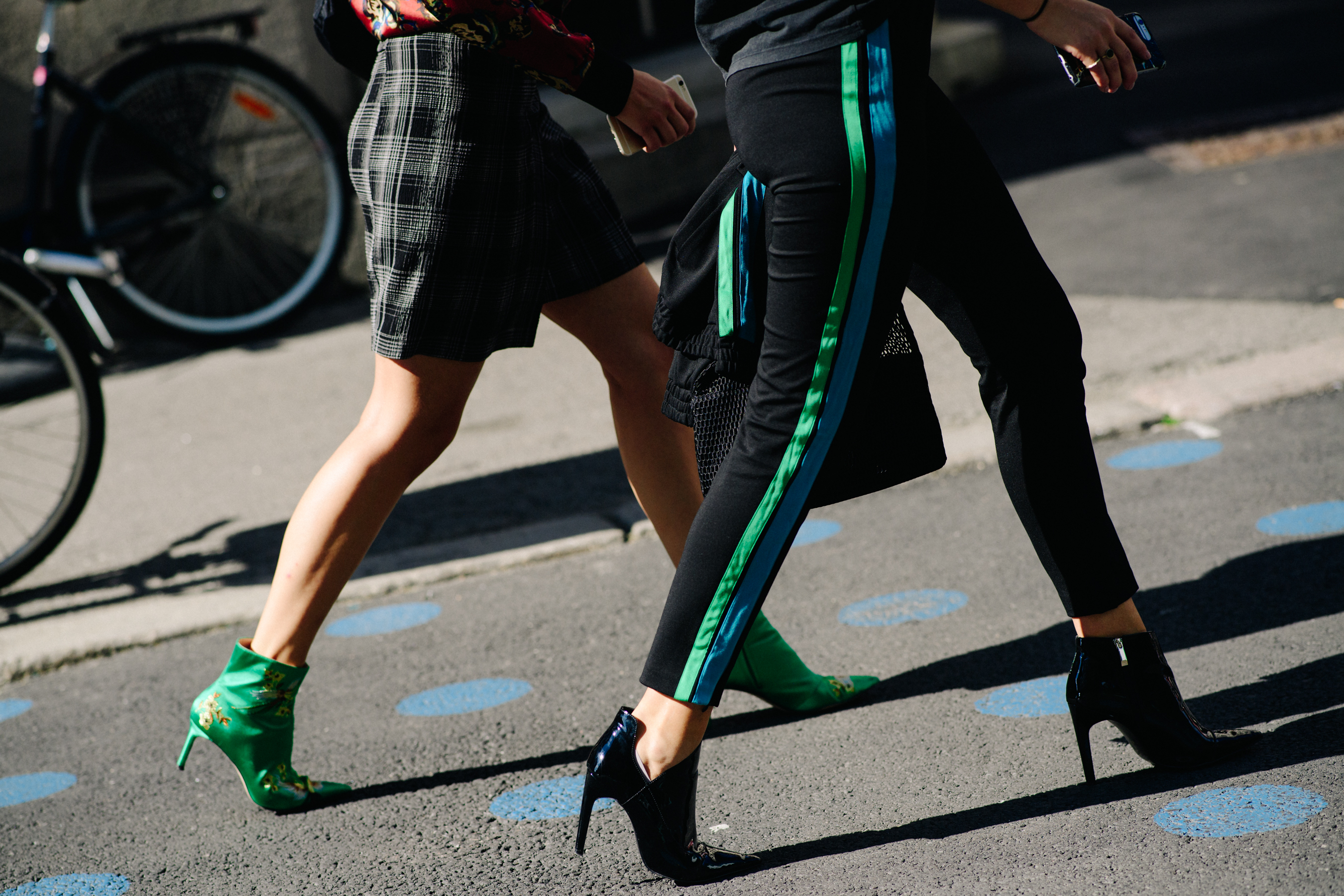 Woman wearing black pants with green