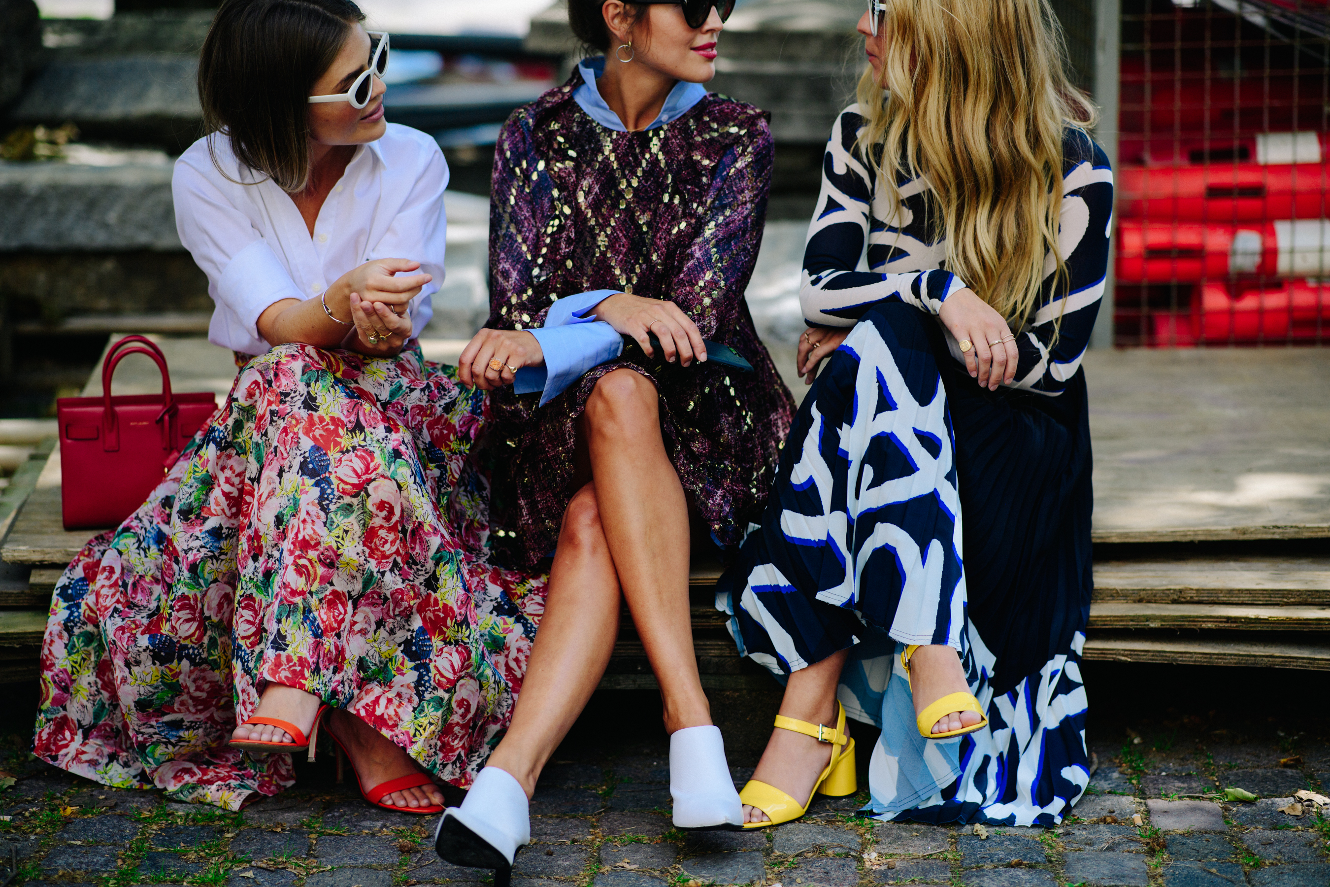 Three bloggers wearing dresses