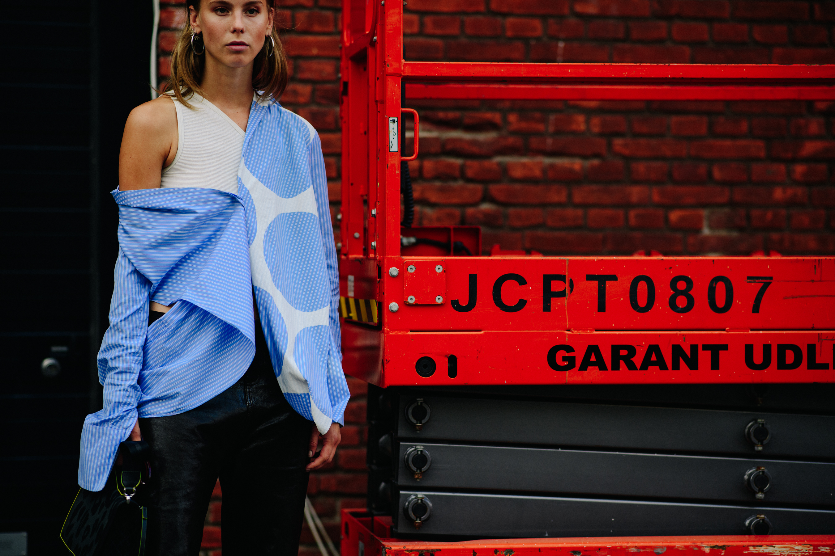 Woman weraing blue shoulderless shirt