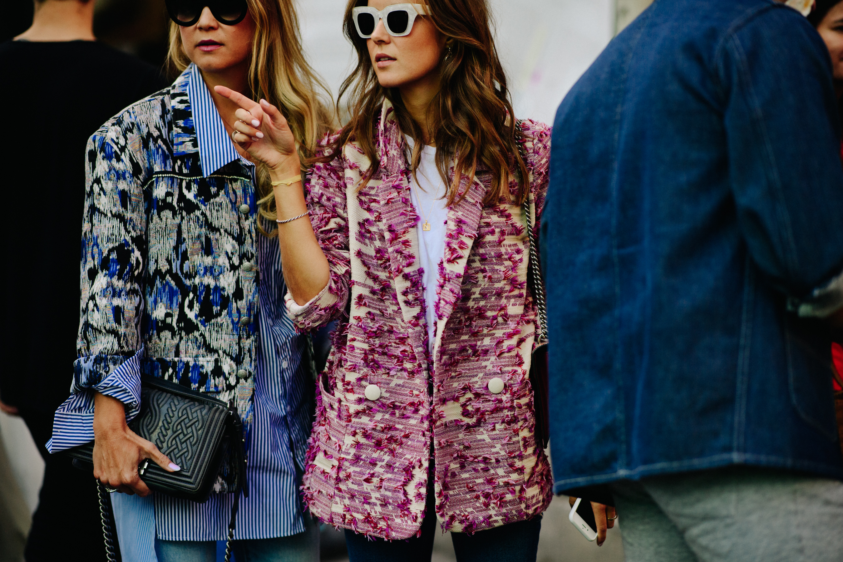 Two women wearing colourful jackets
