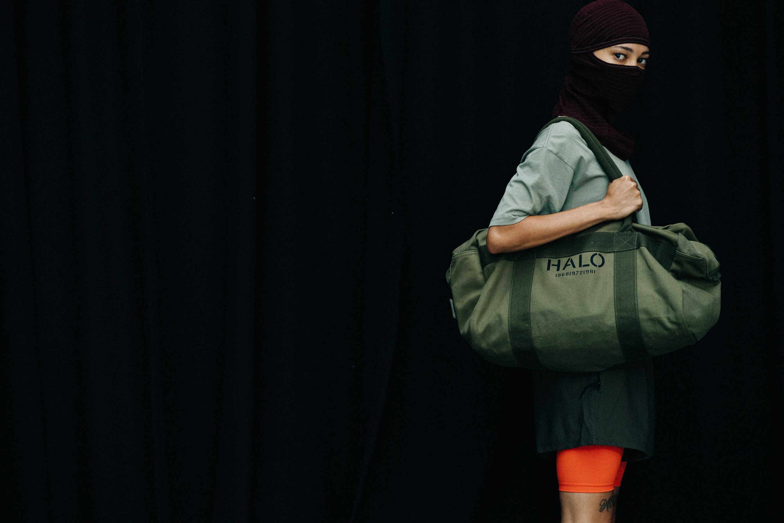 Model with military style bag