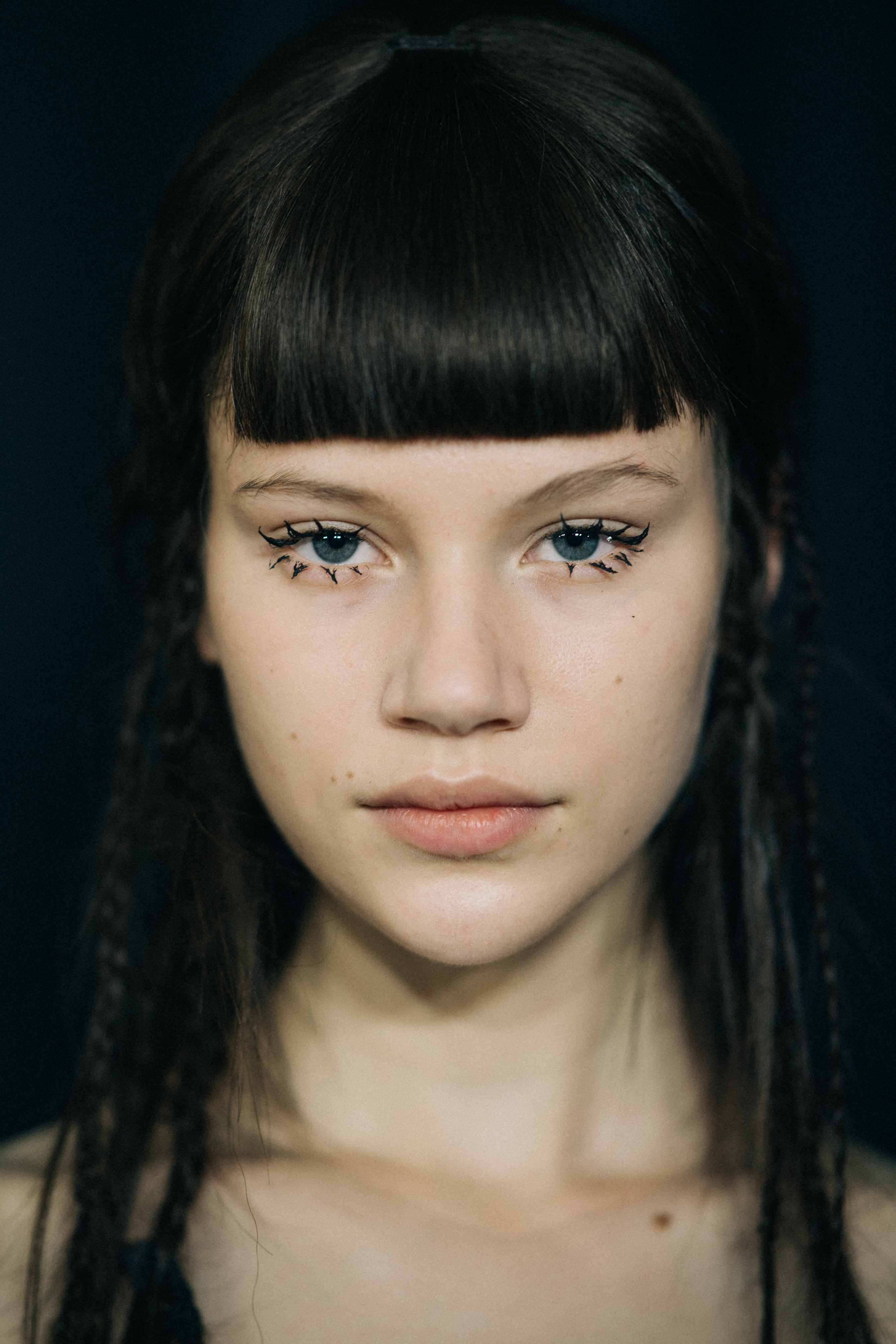 Model with braided hair before a show