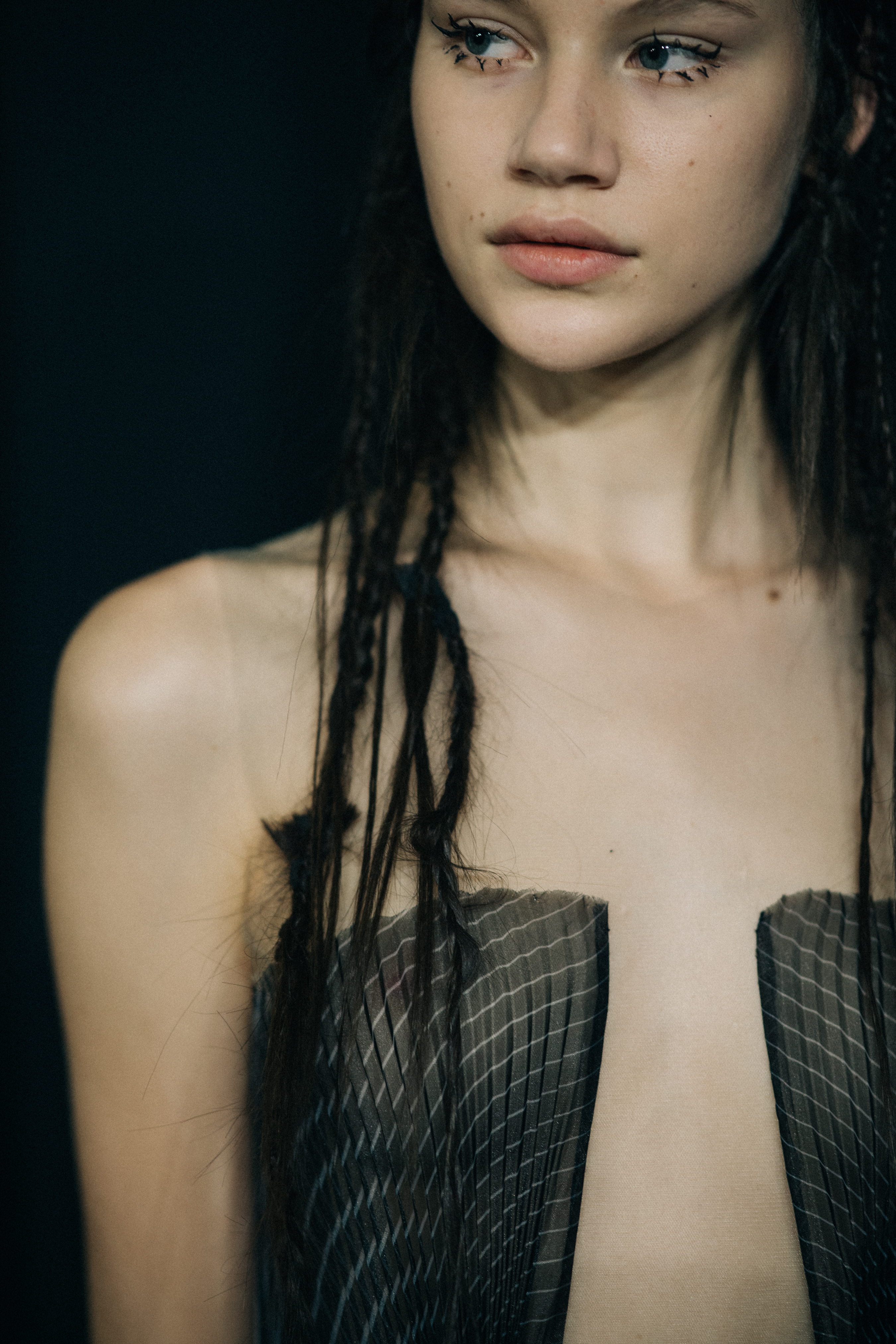 Model with braided hair before a show
