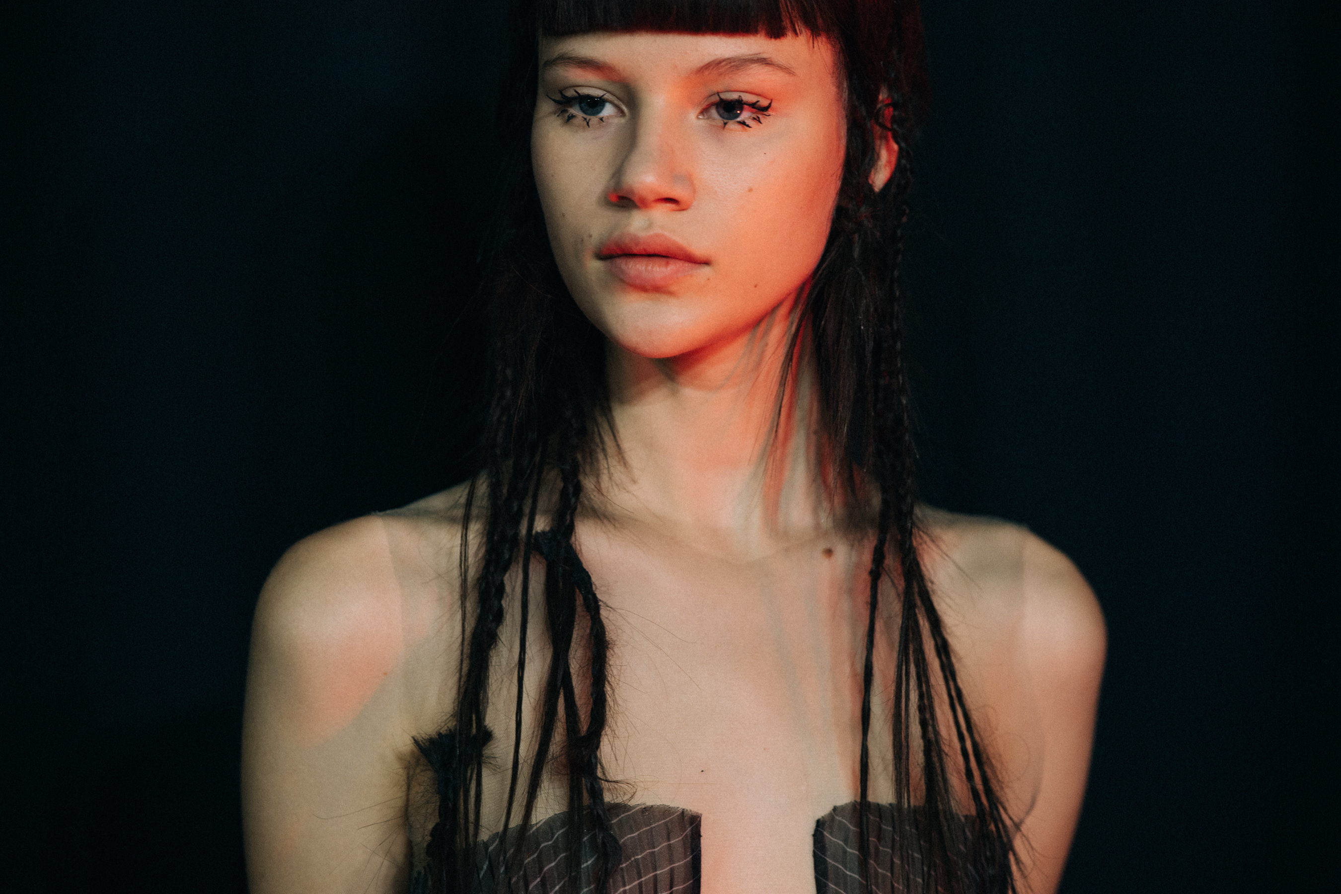 Model with braided hair before a show
