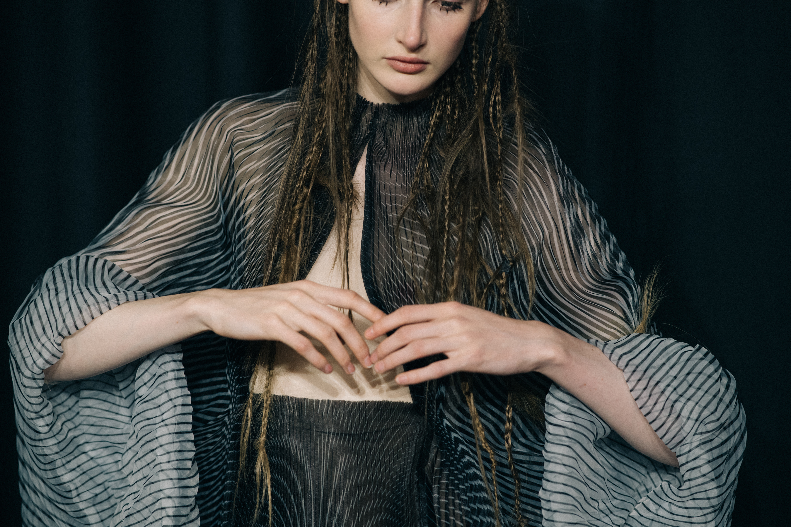 Model wearing beautiful dress before a show