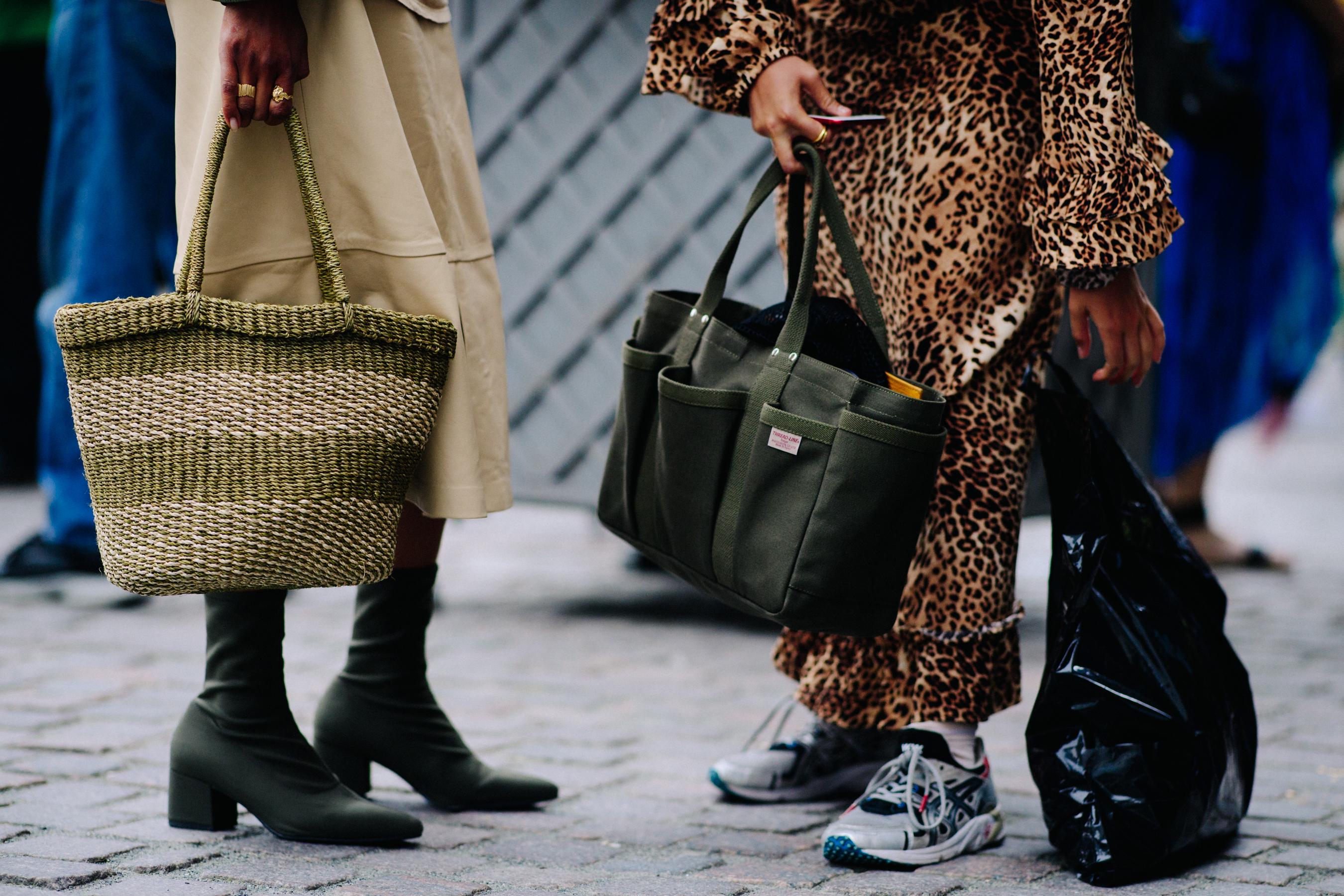 Two women with large handbags
