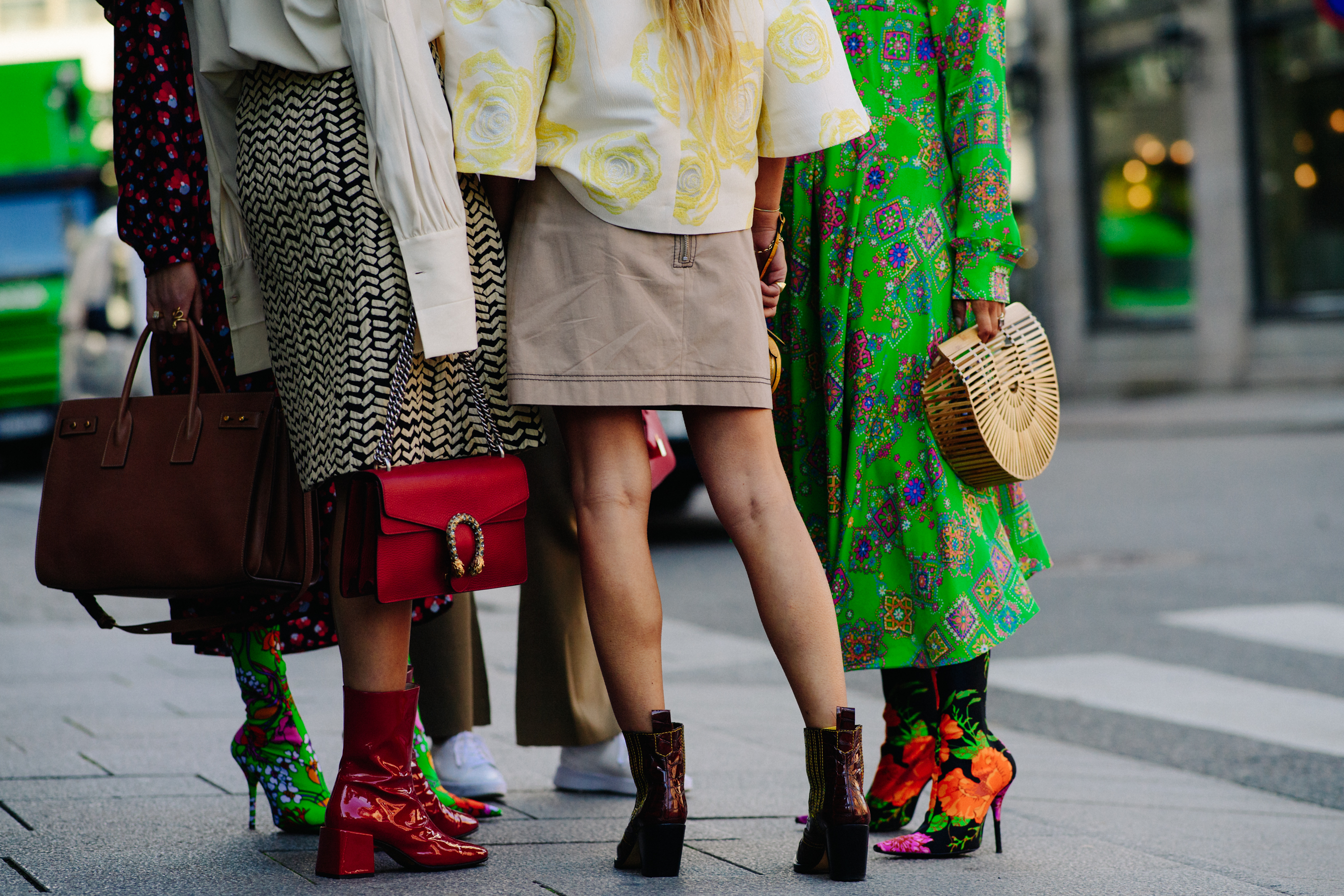 Group of women wearing colourful dresses