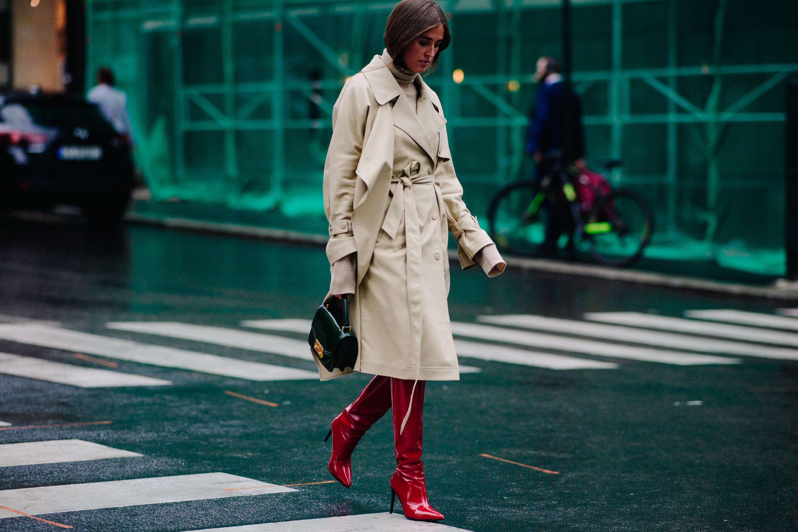 Blogger wearing red boots and trench coat