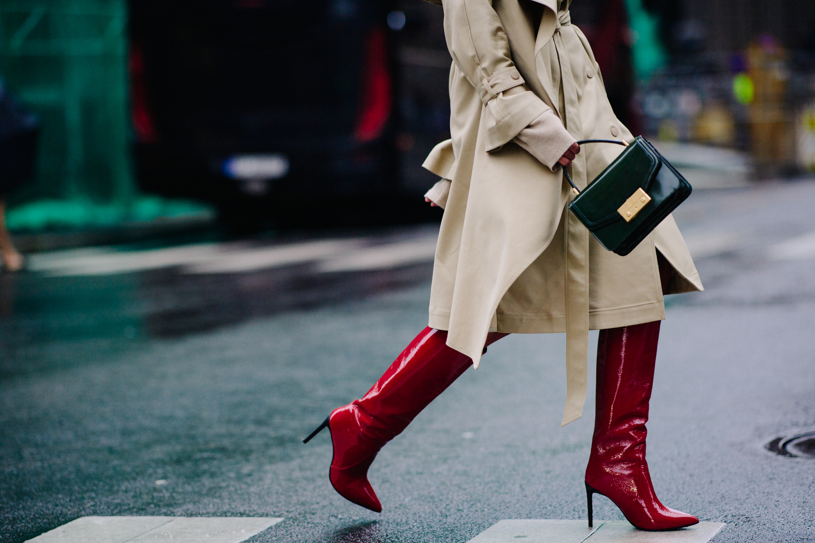 Blogger wearing red boots and trench coat