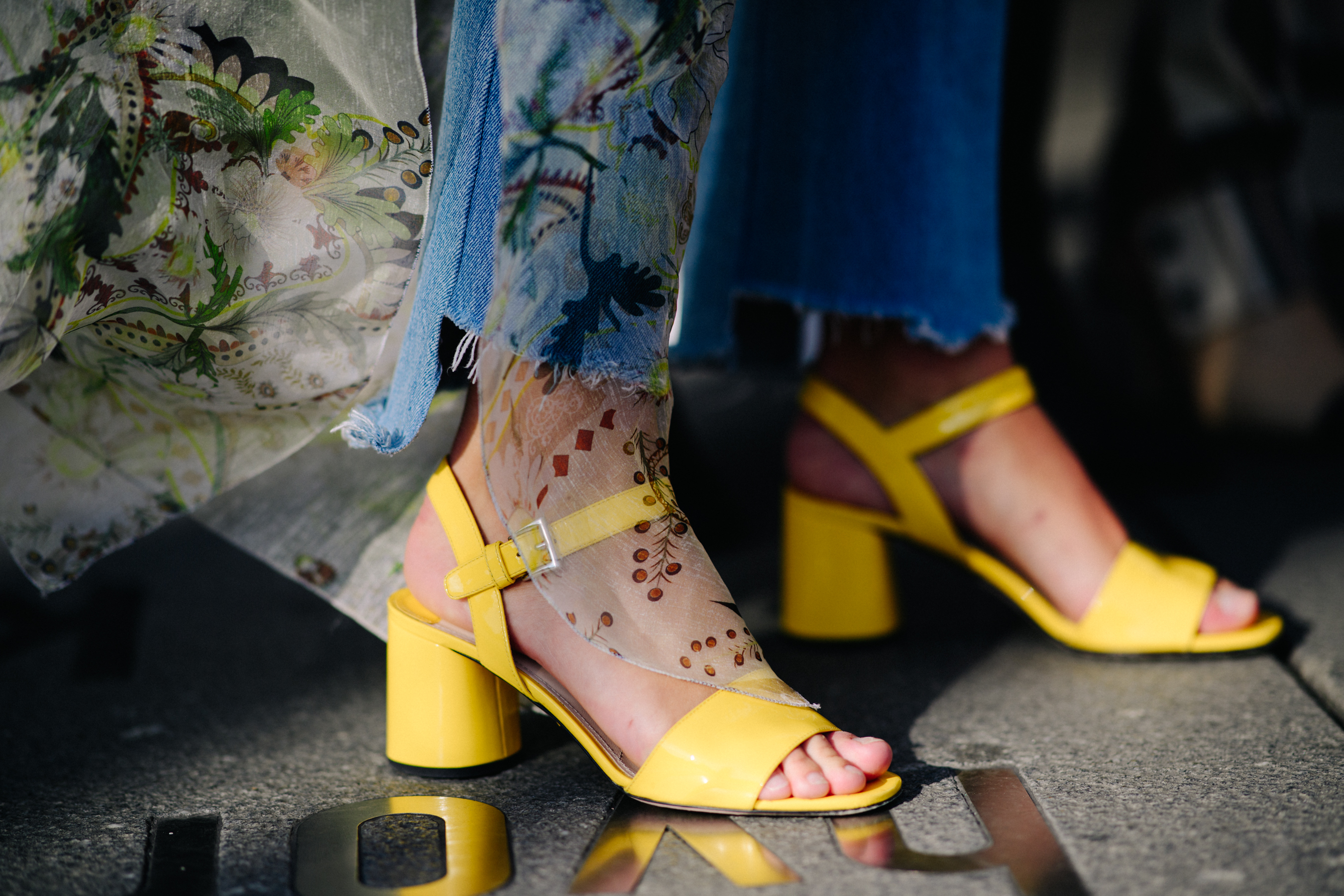 Woma wearing yellow sandals and a dress