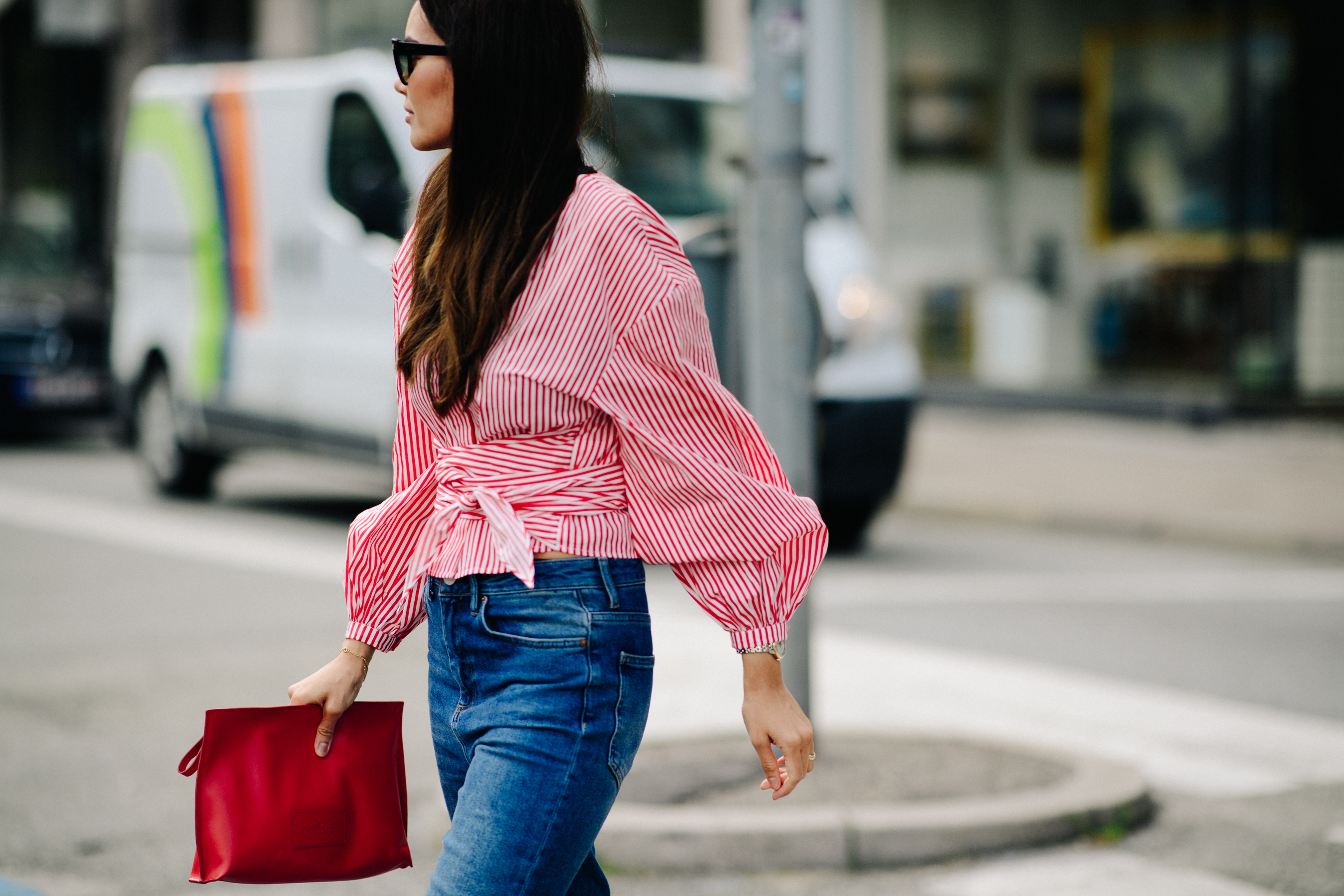 Woman wearing red shirt and denim