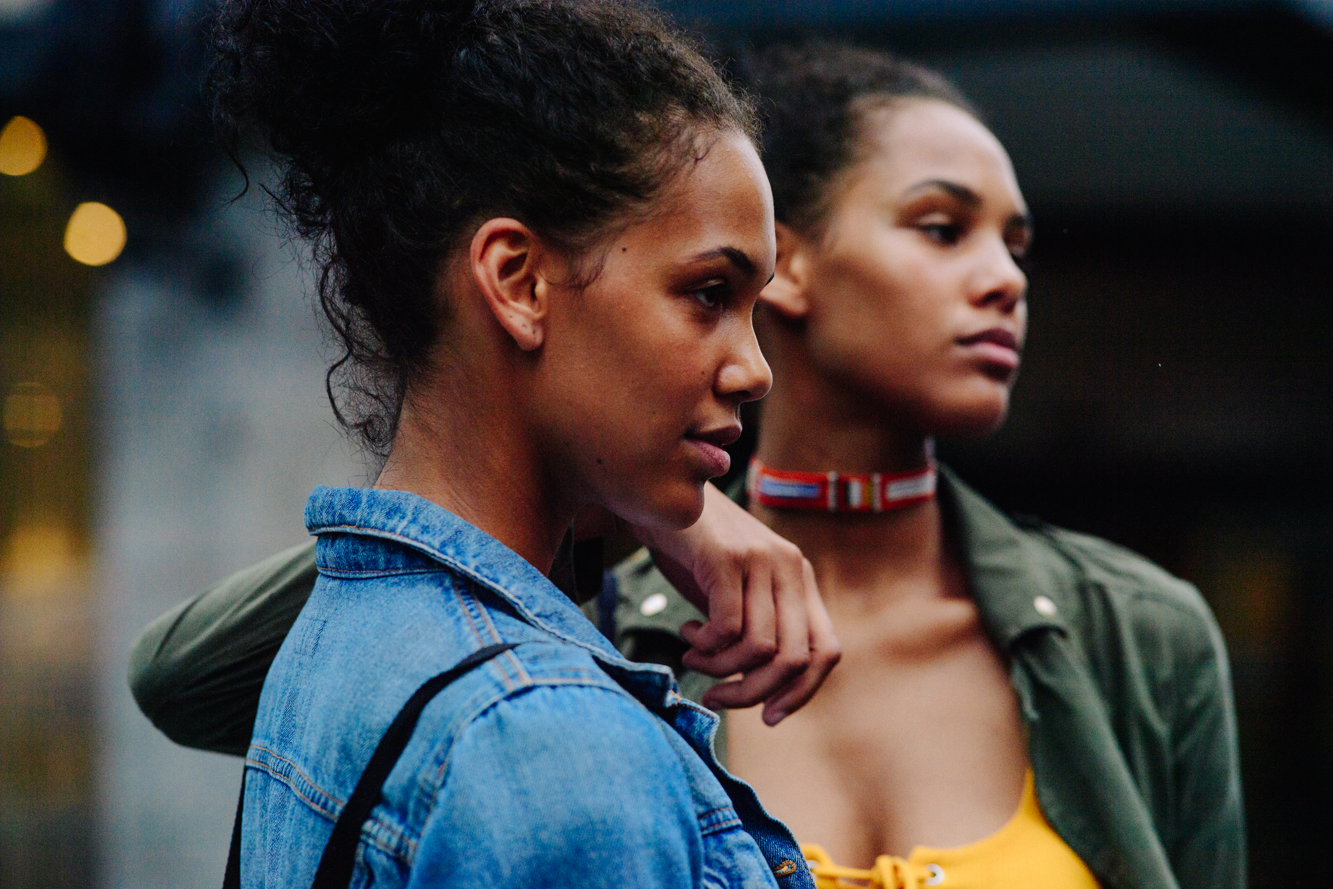Two models wearing denim jackets