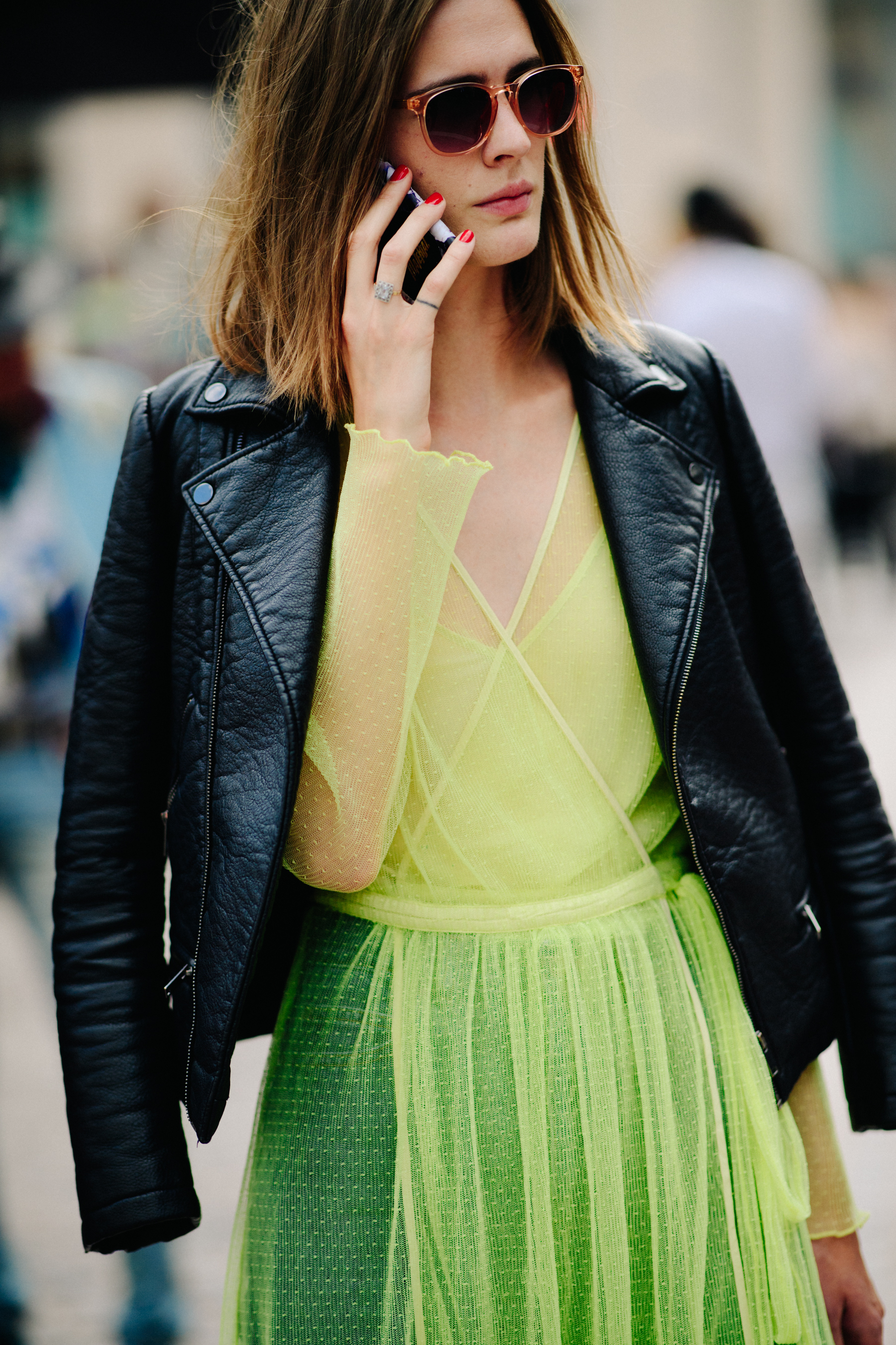 Woman wearing transparent dress and jacket