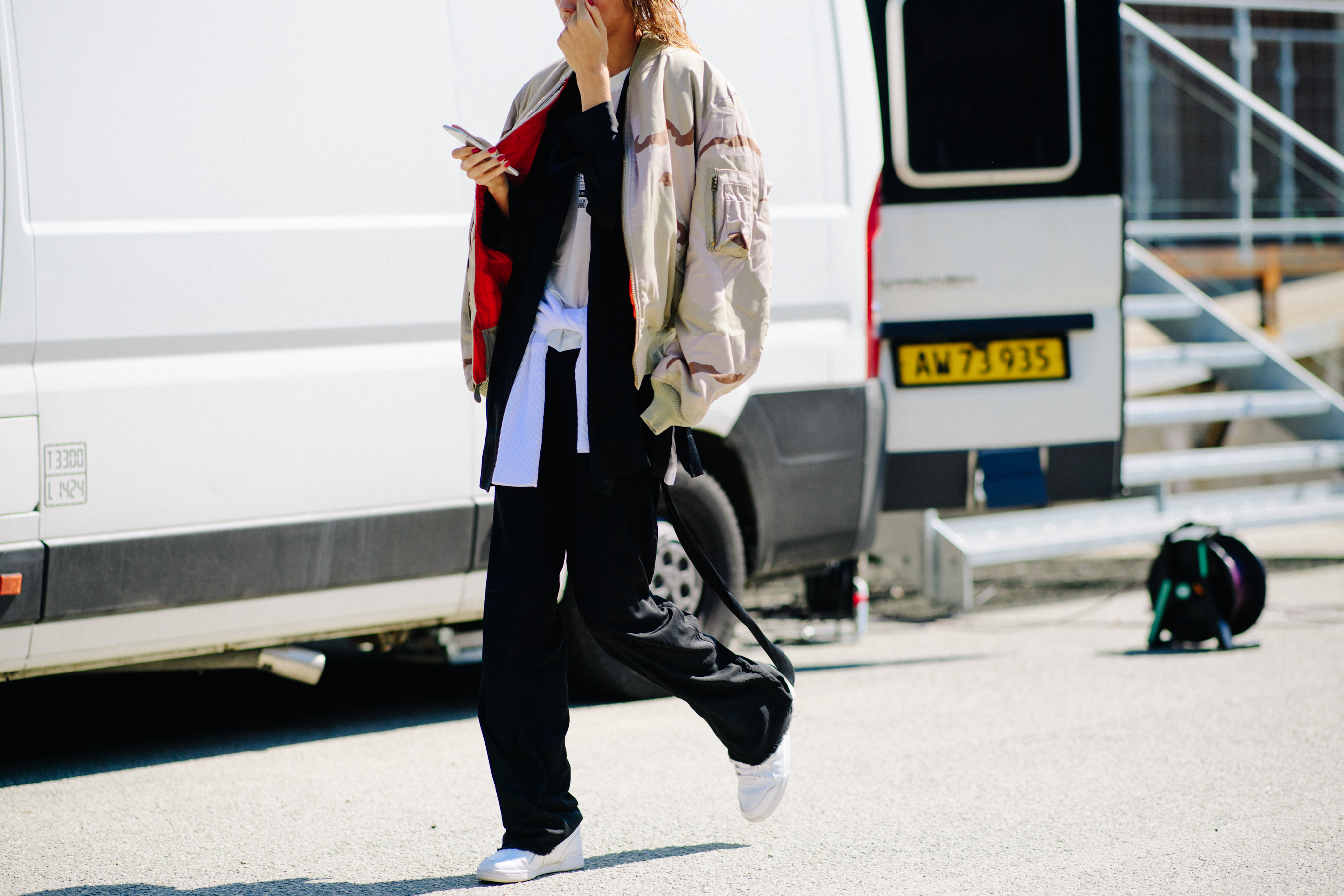 Woman wearing beige bomber jacket