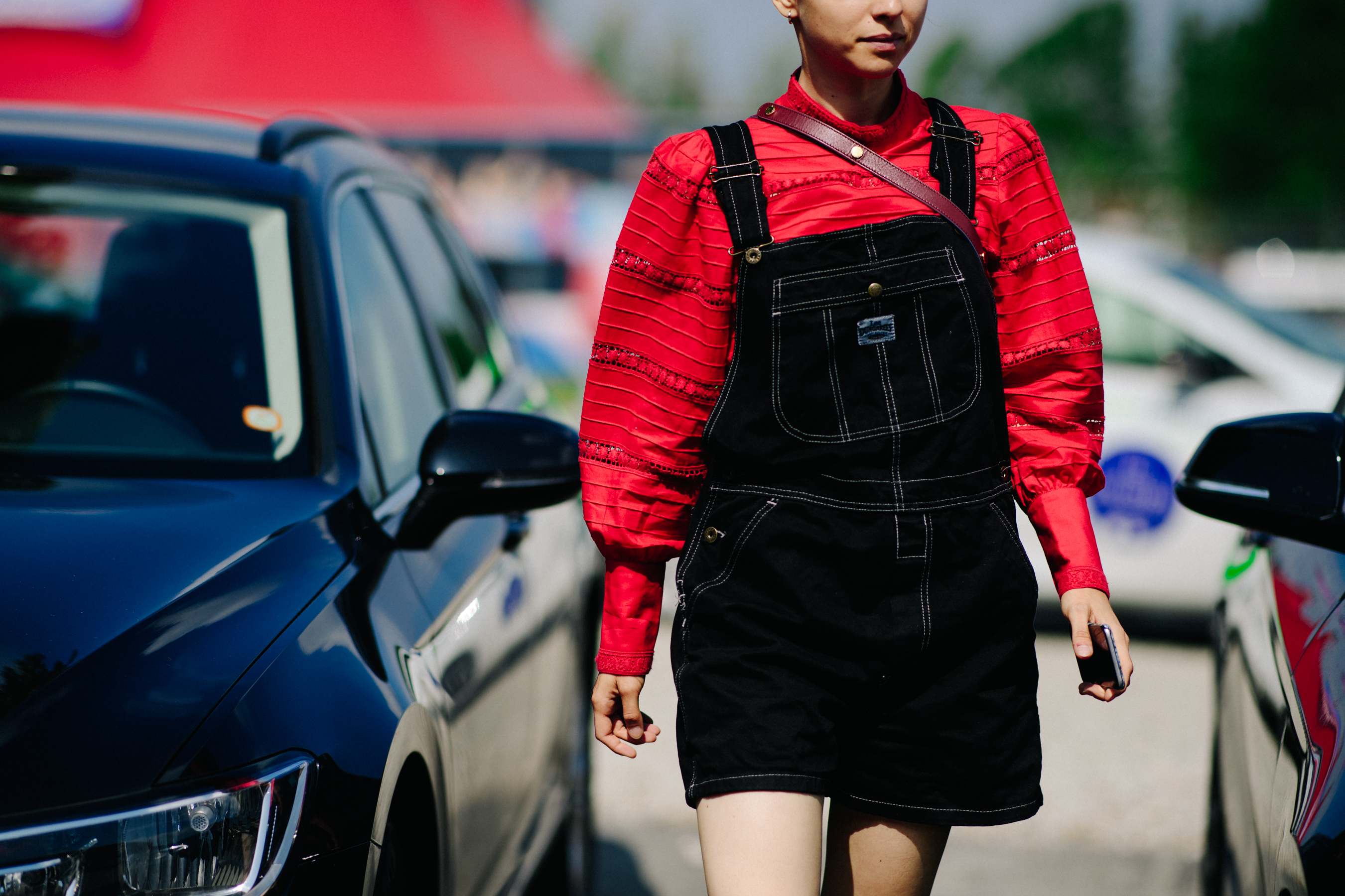 Woman wearing red jacket and jumpsuit