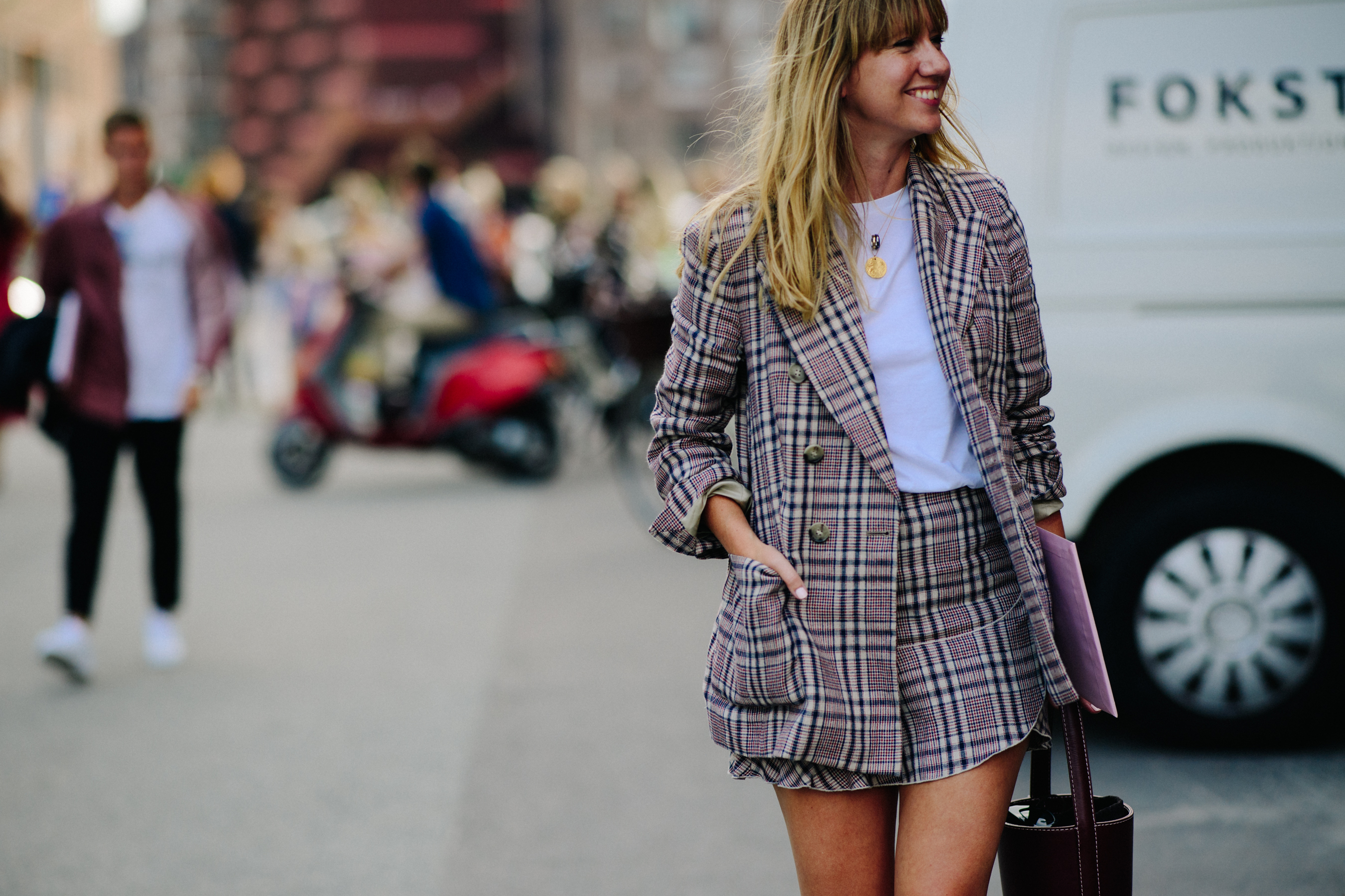 Woman wearing suit with mini skirt