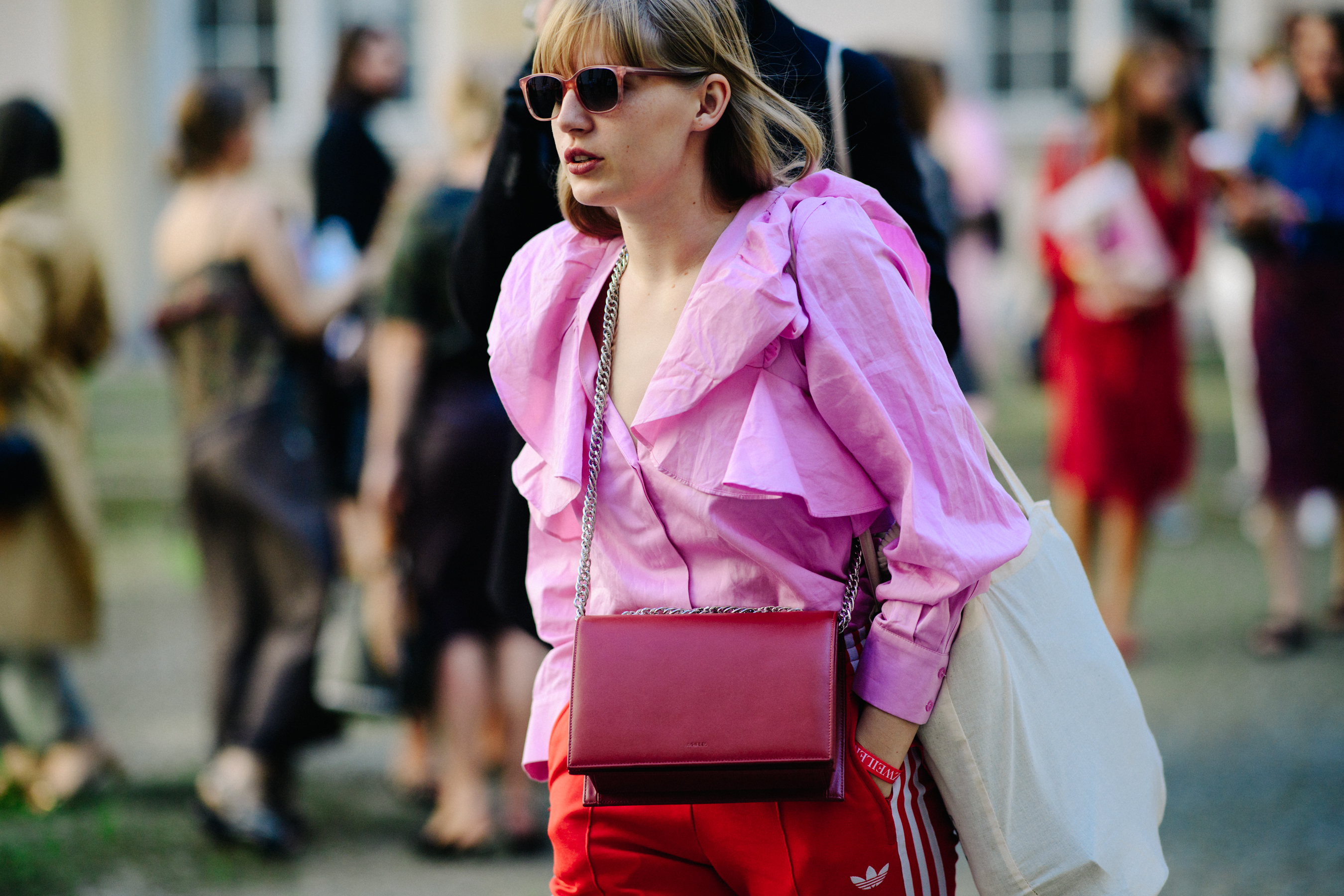 Woman wearing pink shirt nad glasses