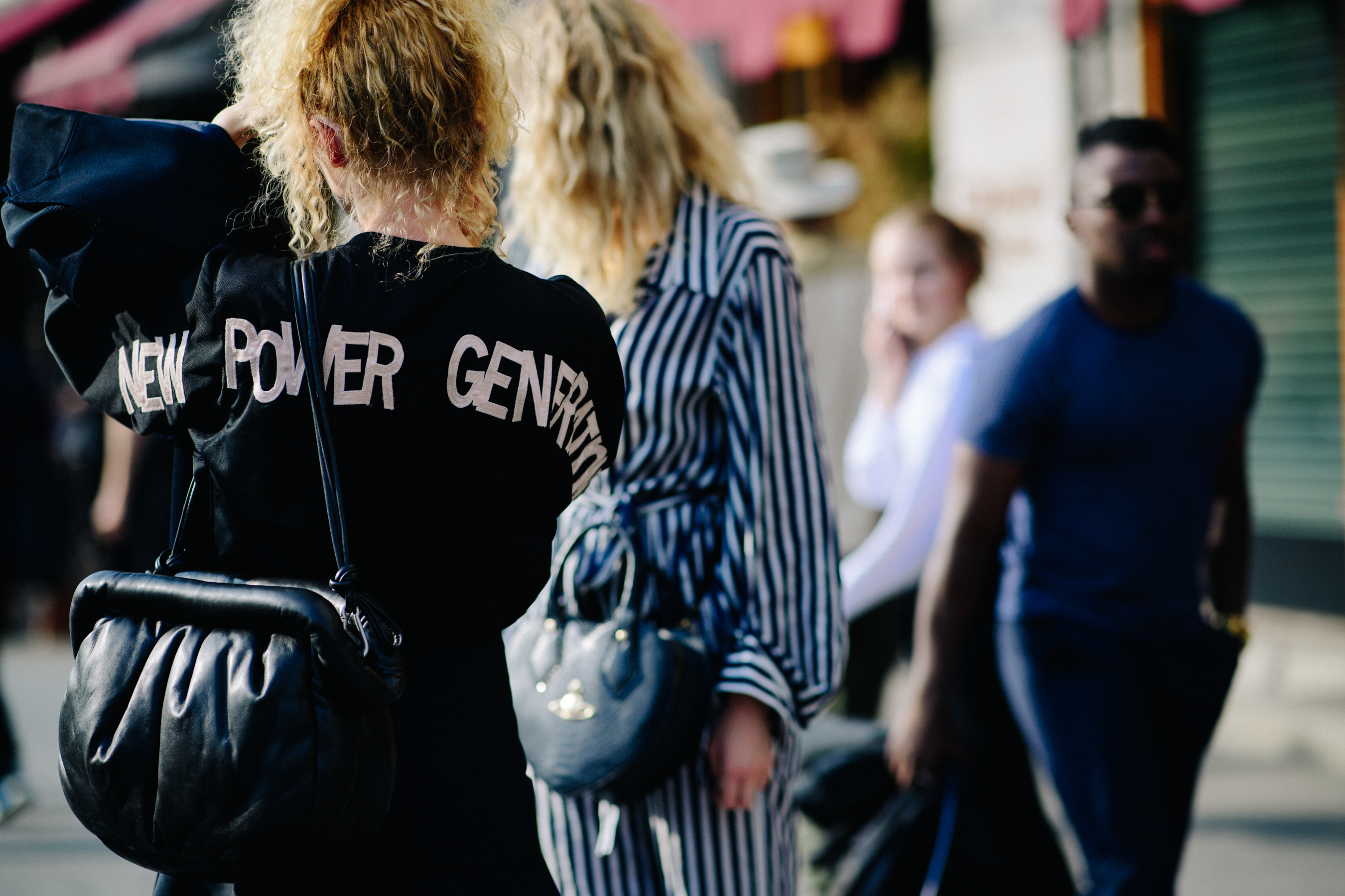 Woman wearing black leather pouch