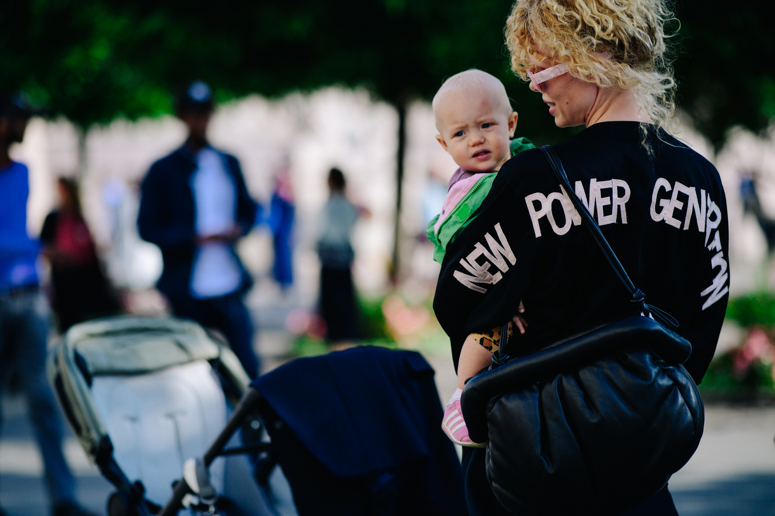 Woman holding a baby before a show