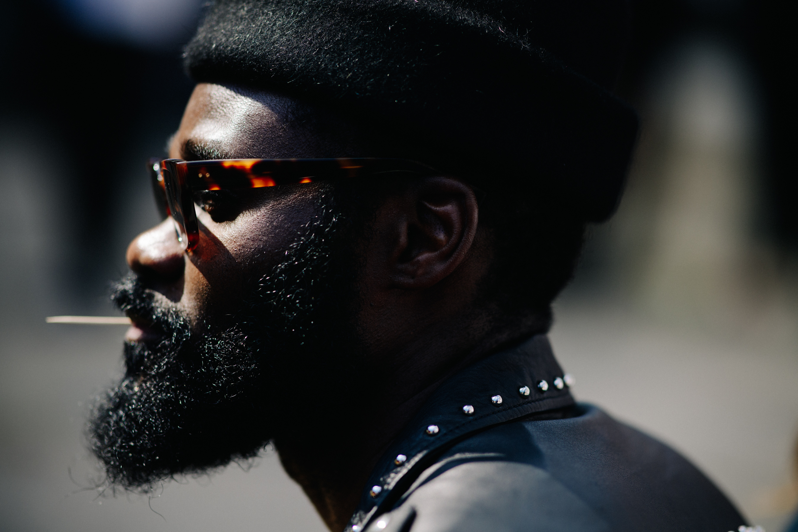 Man wearing traditional hat and glasses
