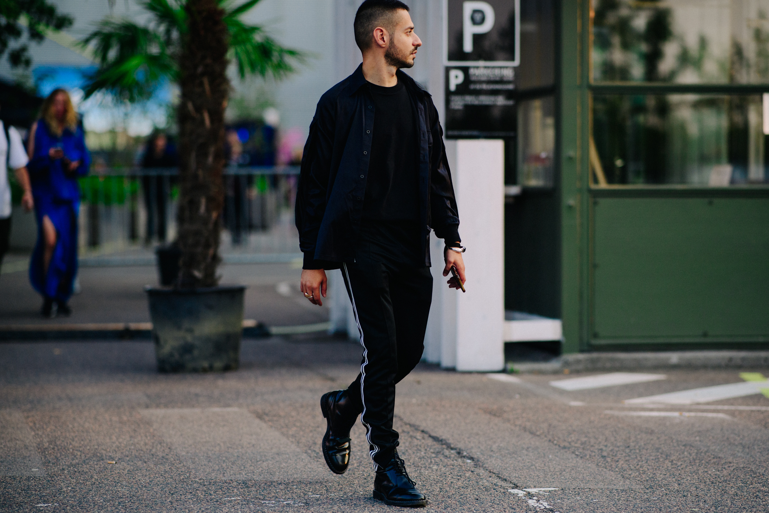 Machine A buyer wearing track pants