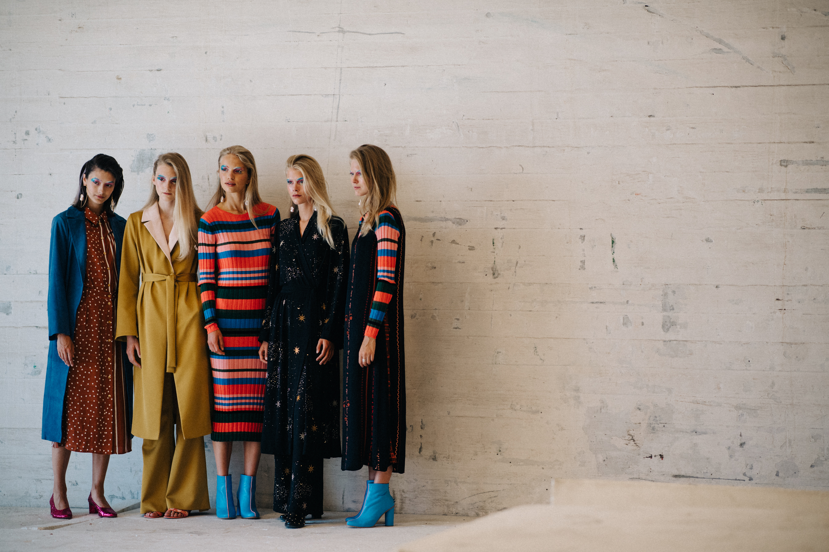 Group of models wearing colourful outfits