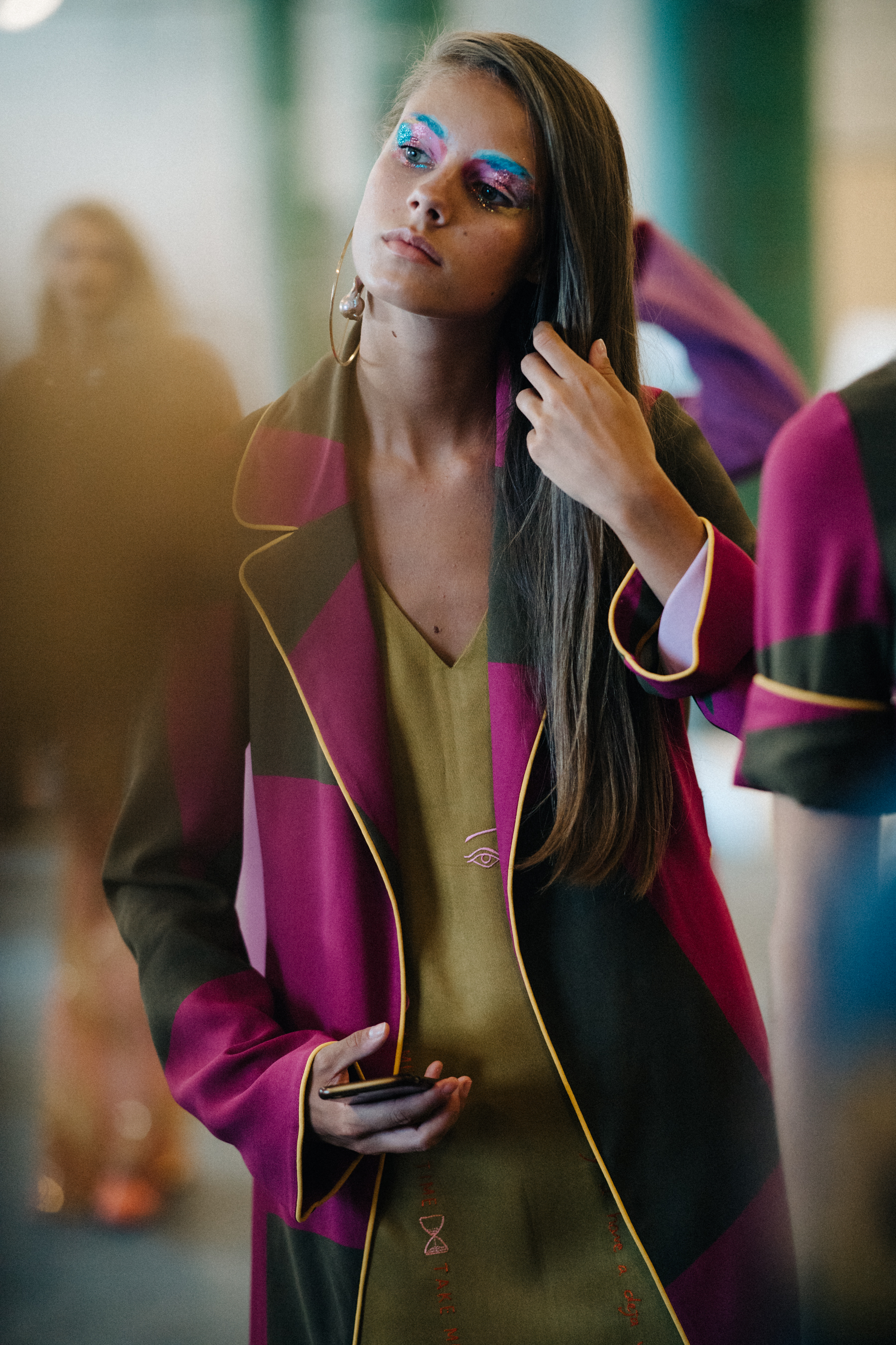 Model wearing colourful dresses