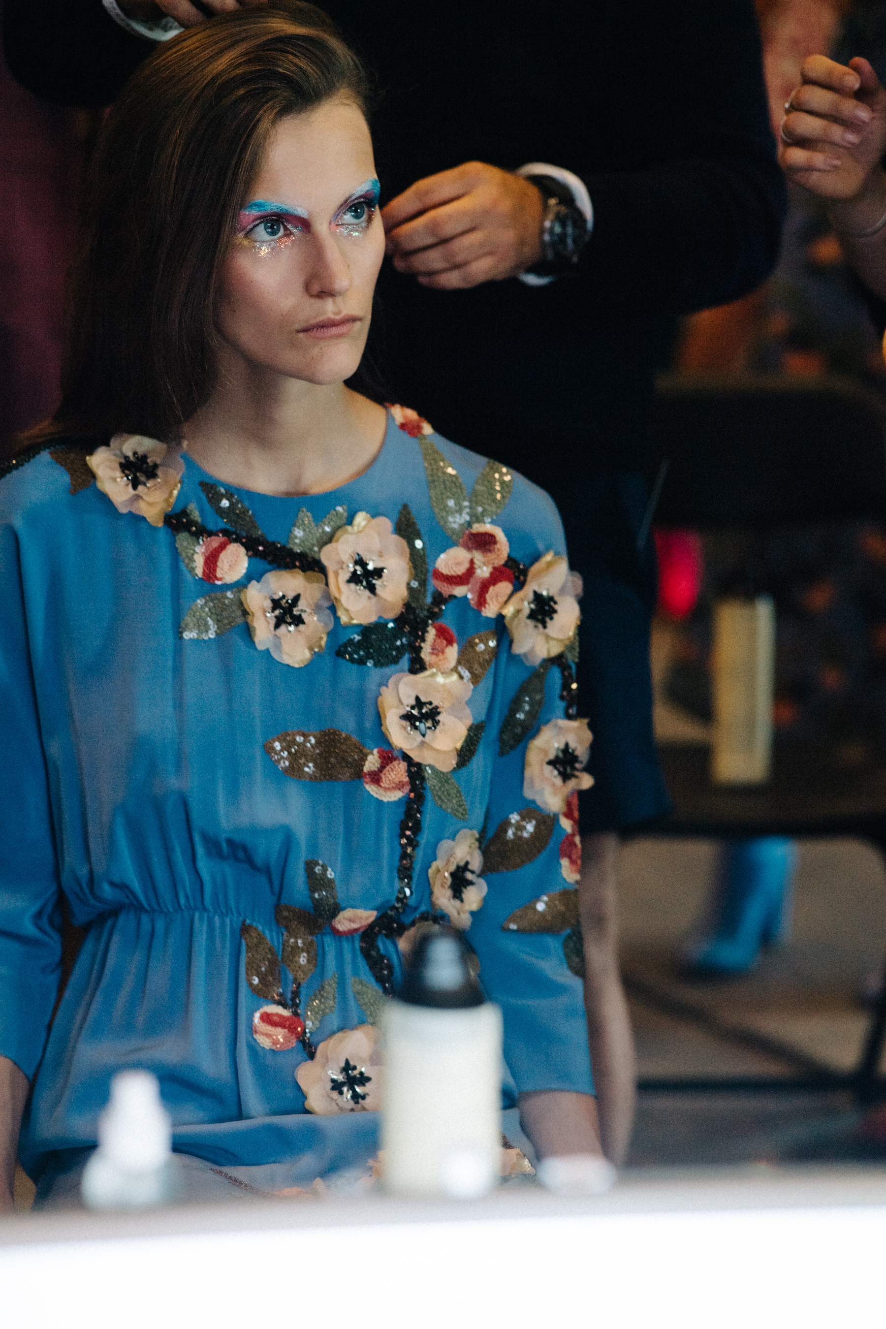 Model wearing blue floral dress