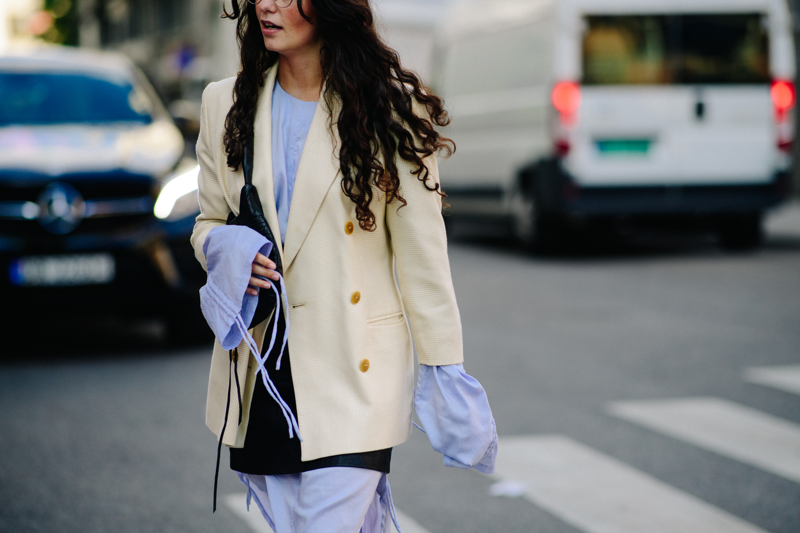 Woman wearing white blazer and a shirt