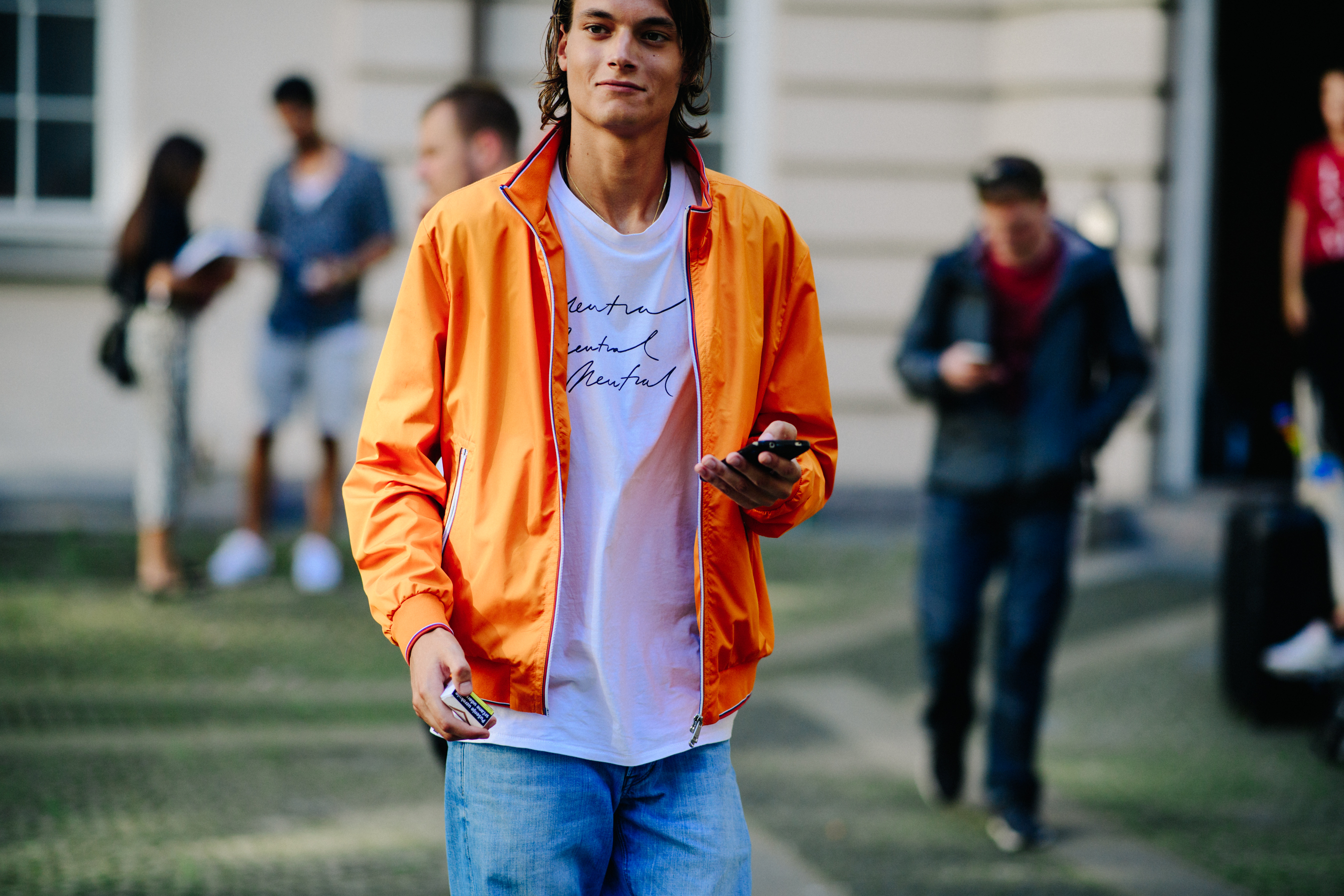 Male model wearing orange bomber