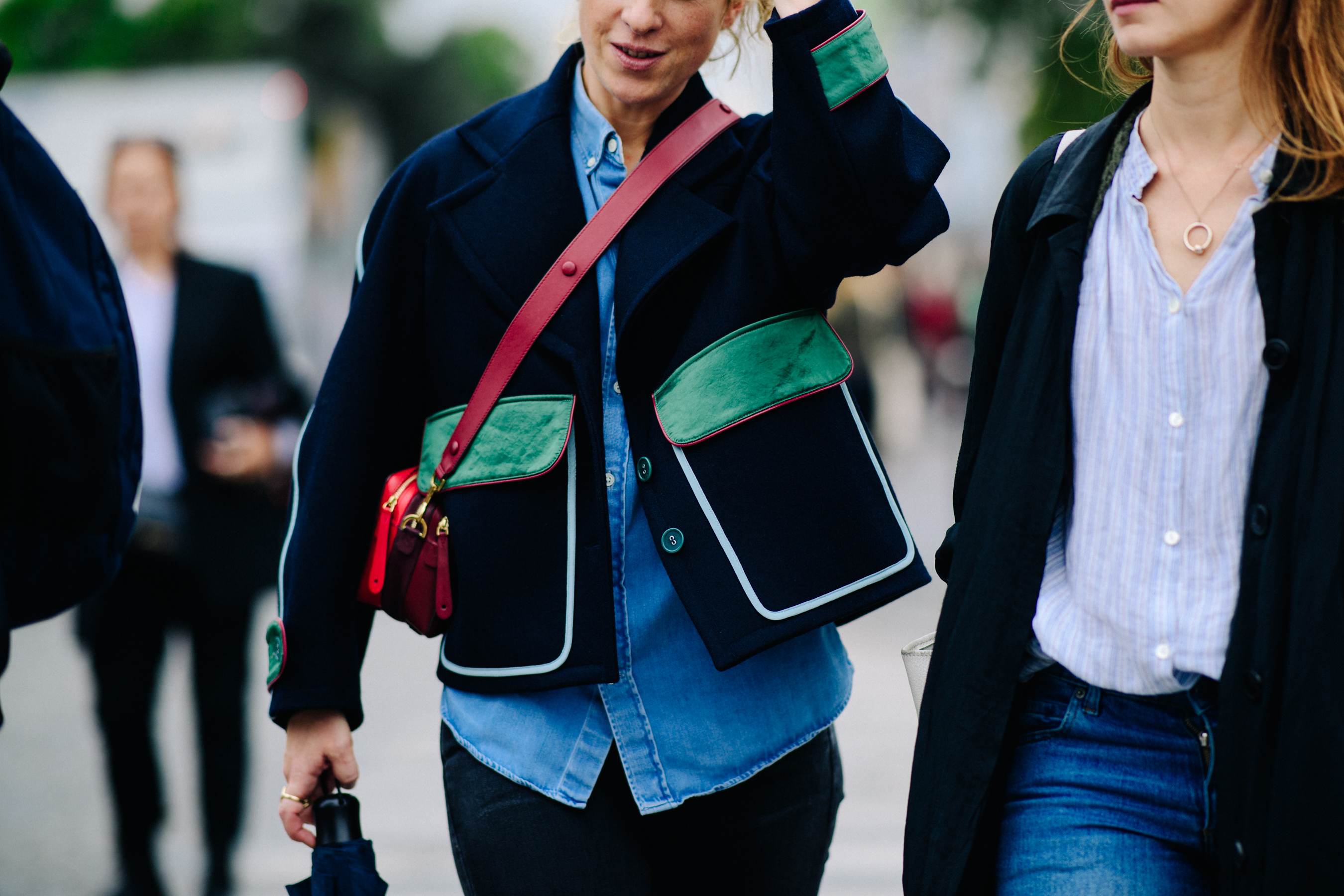 Woman wearing cool jacket with green pockets