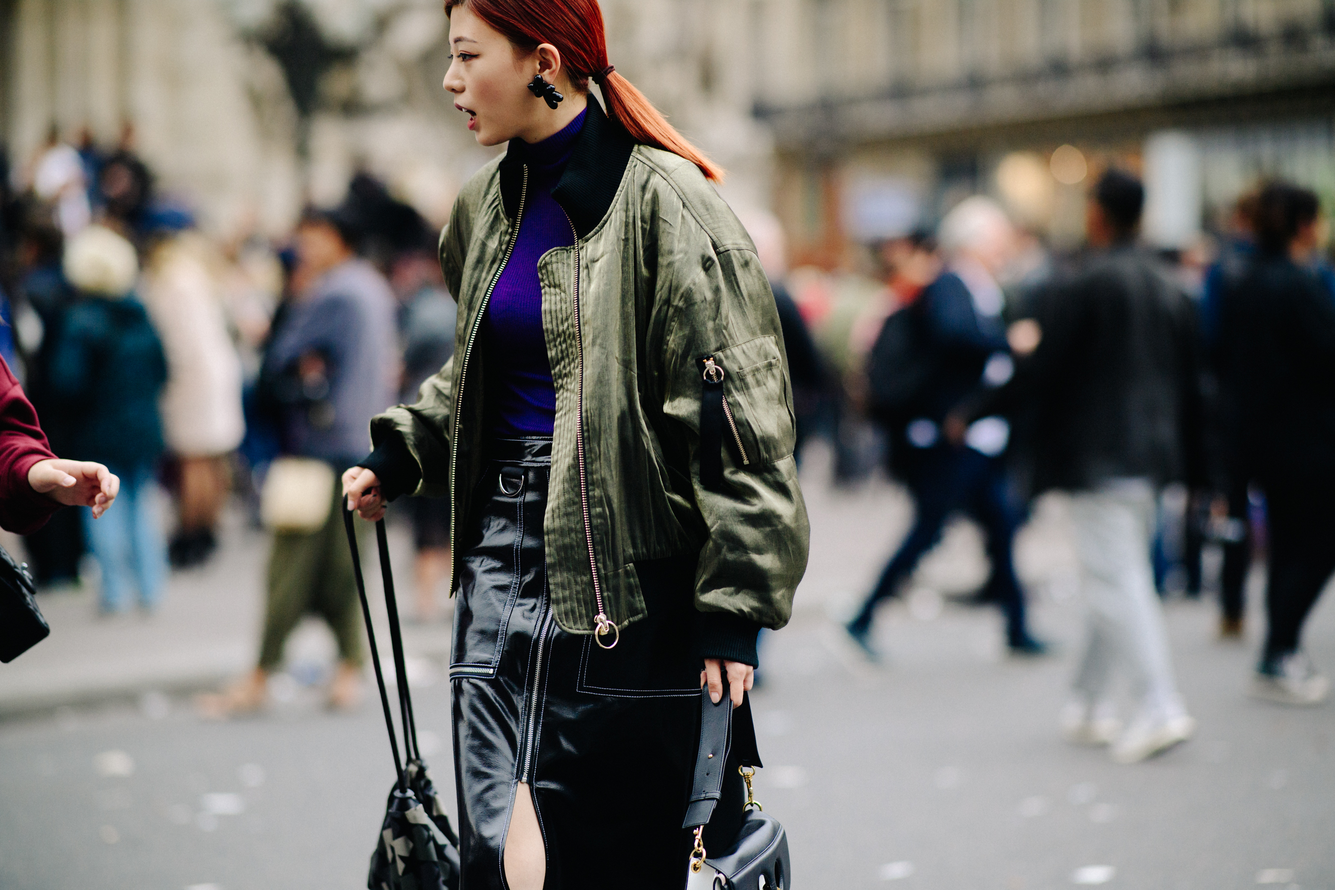 Blogger wearing green bomber jacket